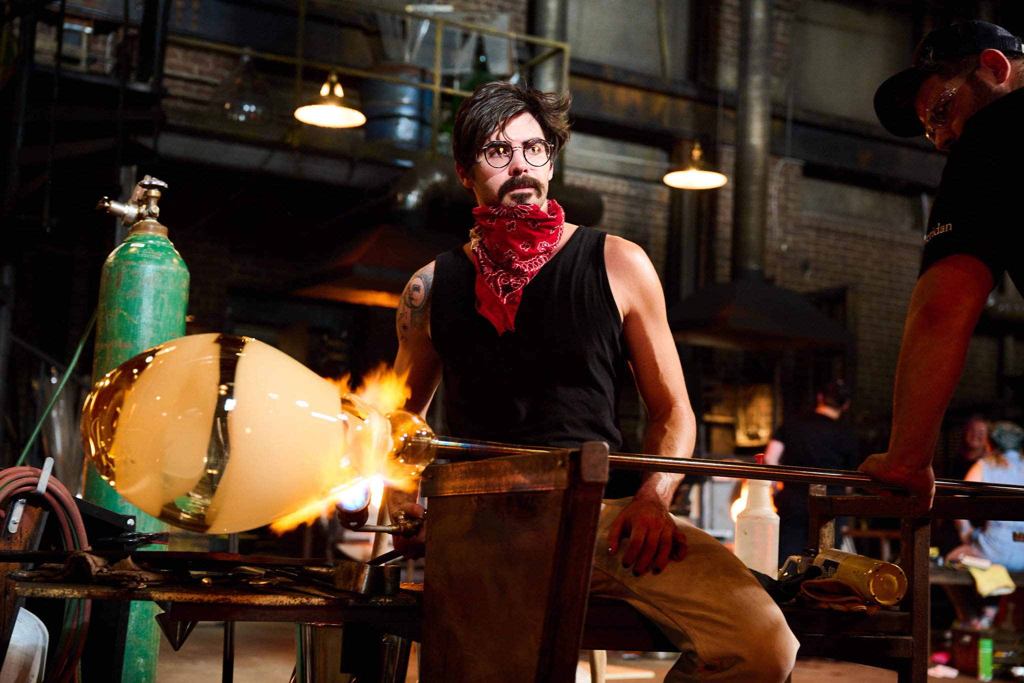 Robert G. Burch near glass on fire