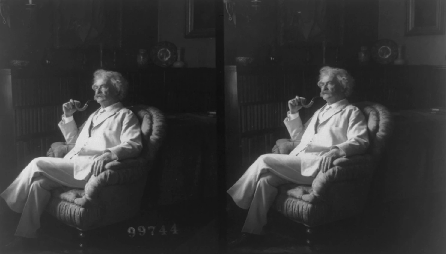 a steroscope slide with a portrait of Mark Twain holding a tobacco pipe