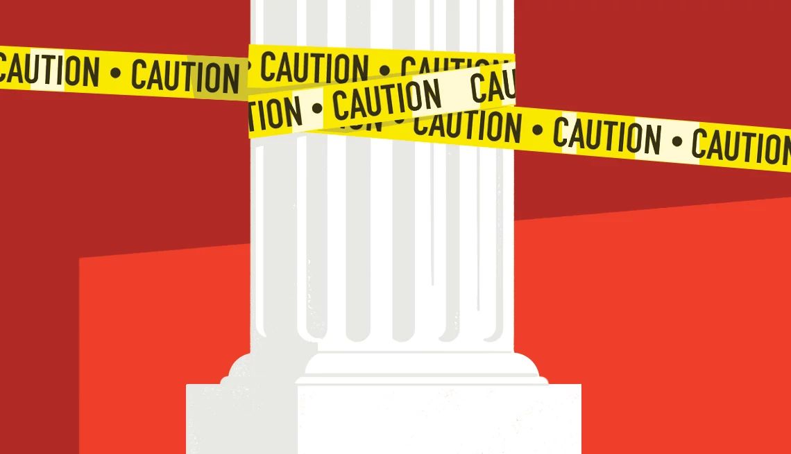 Banks can help scam victims a white pillar with caution tape around it