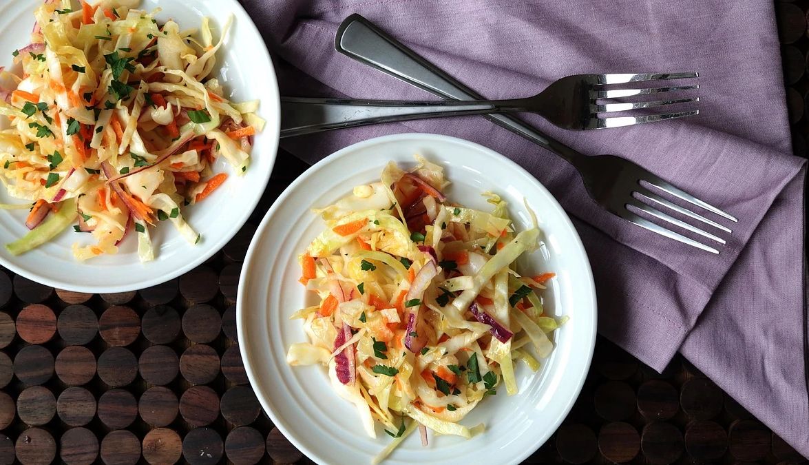 Vinegary coleslaw A close-up view of vinegary coleslaw on plates
