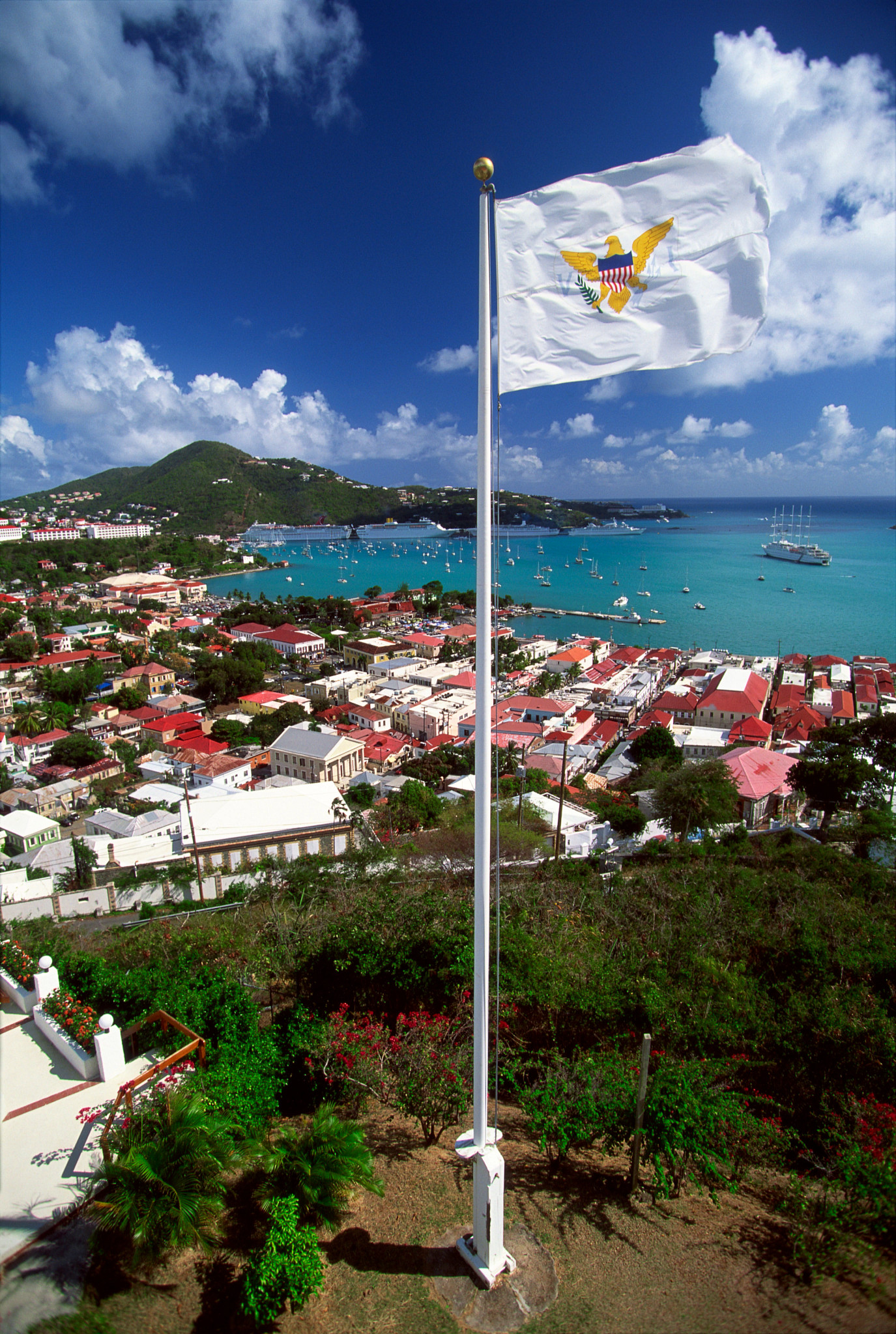 Virgin Islands Flag flying on overlook above harbor, St. Thomas