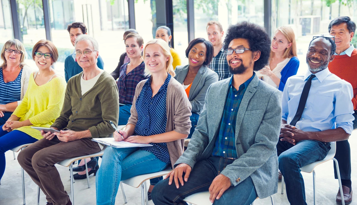 Group of people smiling in classroom