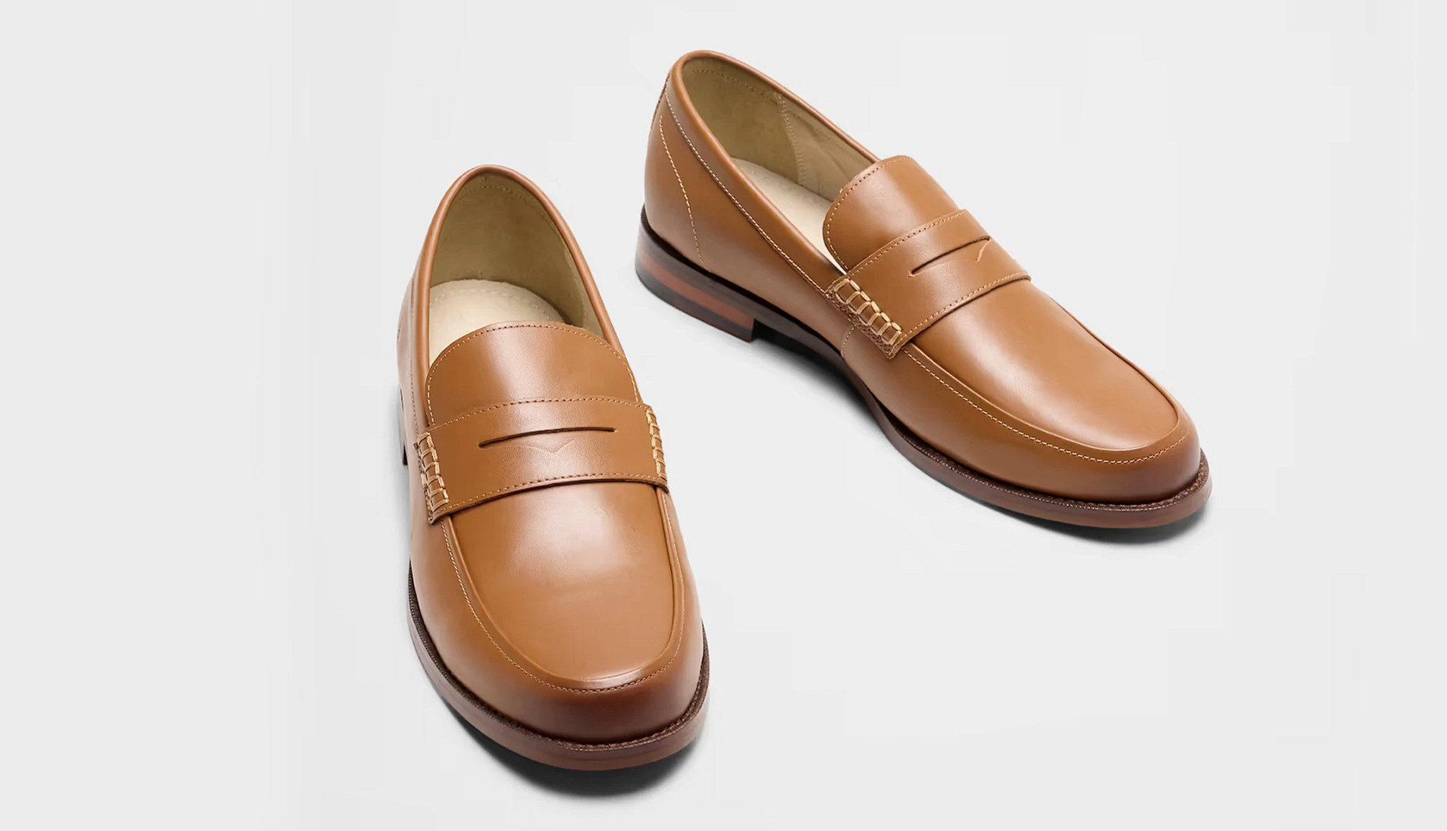 a pair of brown leather mens loafers