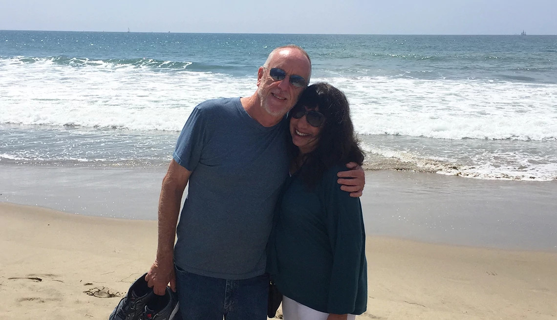 Photograph of Ann Brenoff and spouse together at the beach
