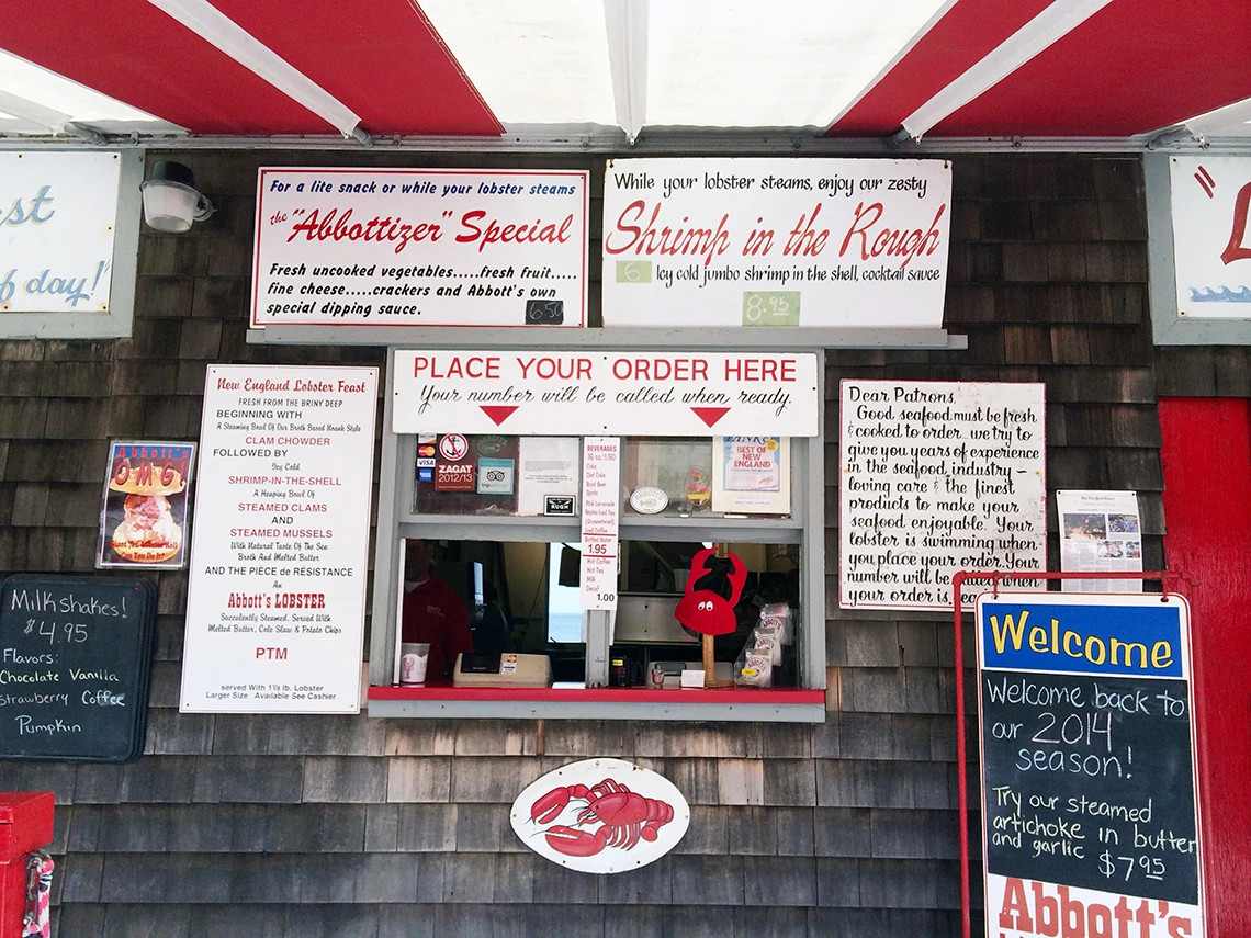 igns around an order counter at a seafood restaurant