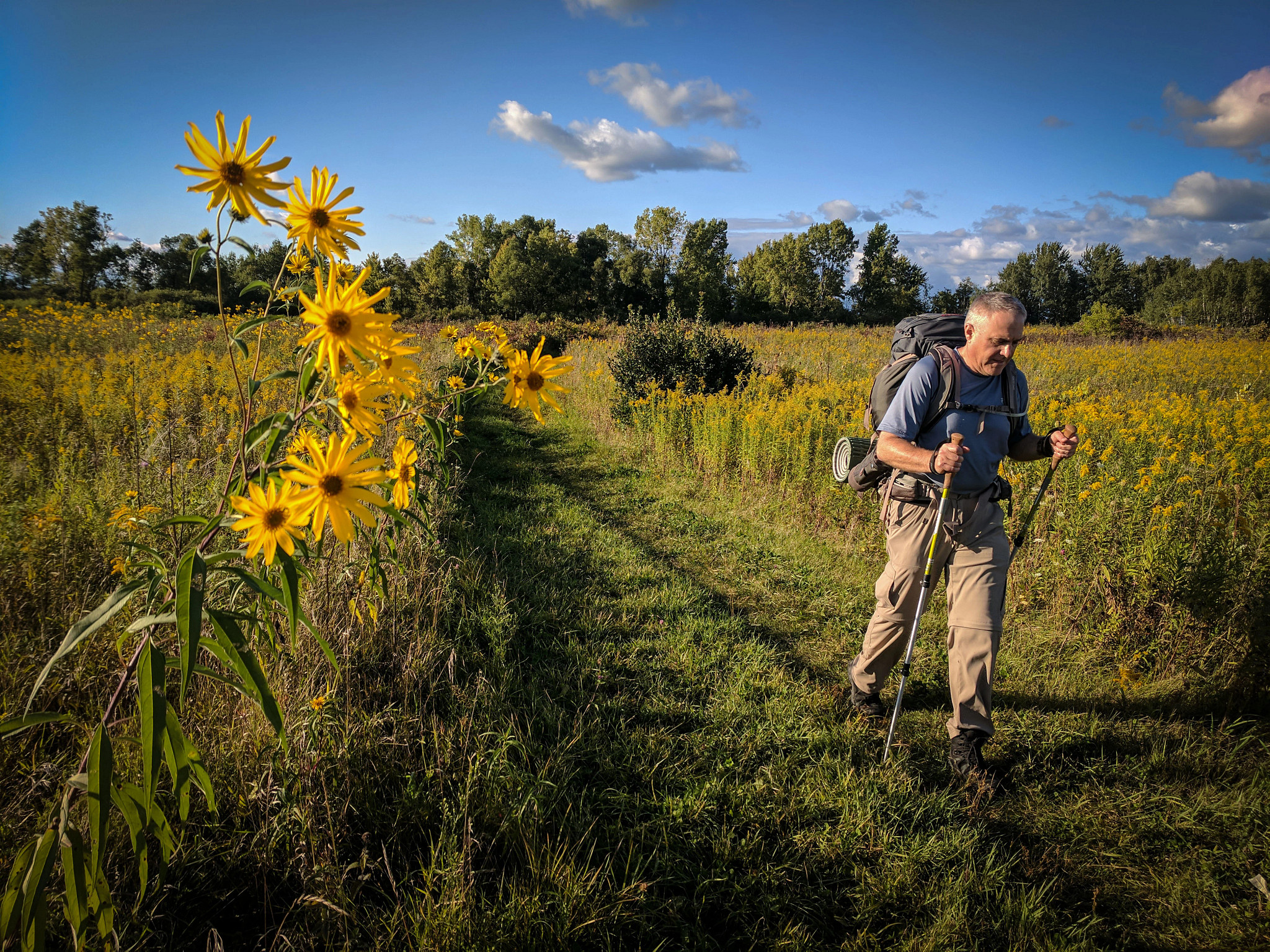 a man hiking through a field