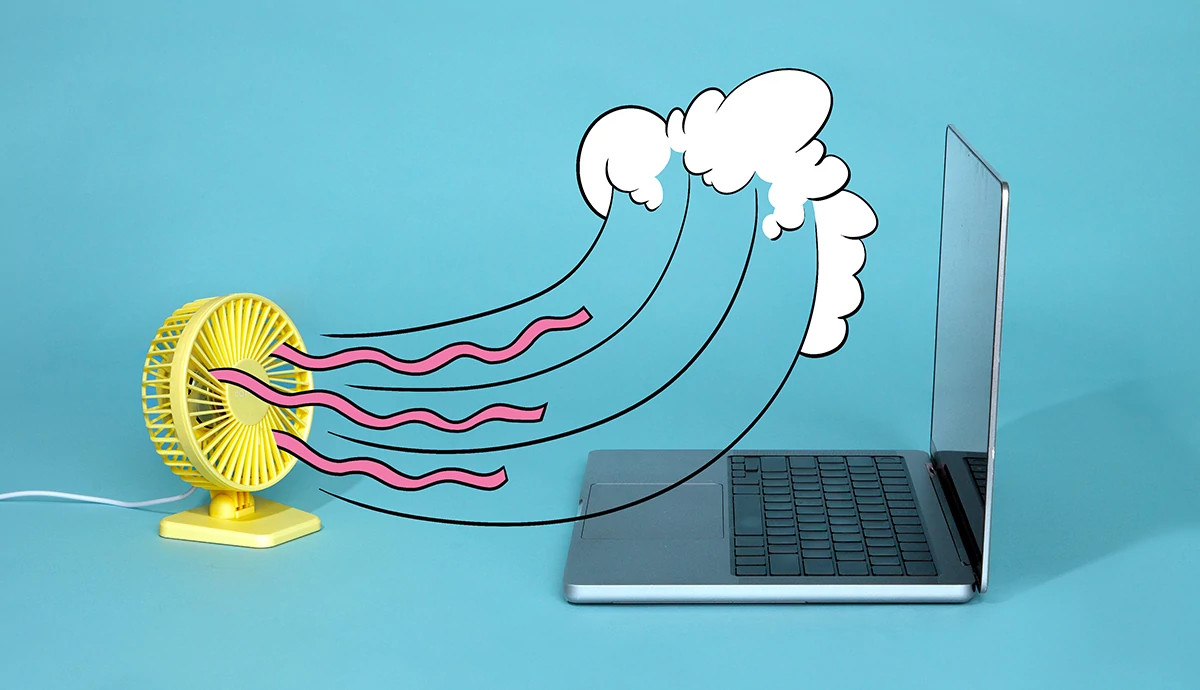 A fan blows animated waves on a laptop.