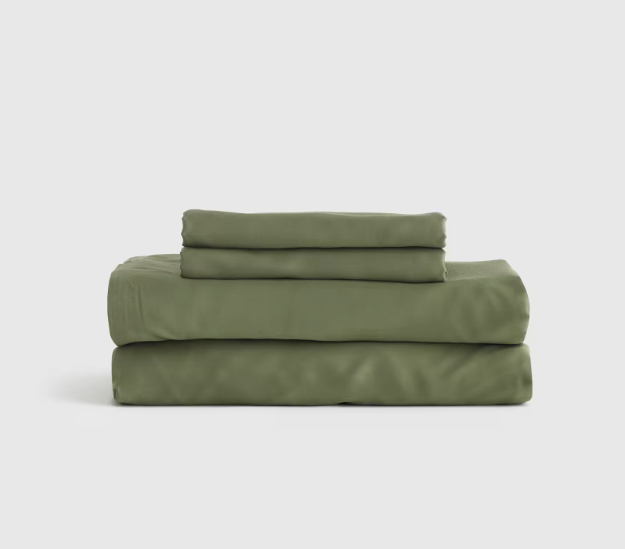 A Quince Bamboo Sheet Set folded and stacked on a white background.