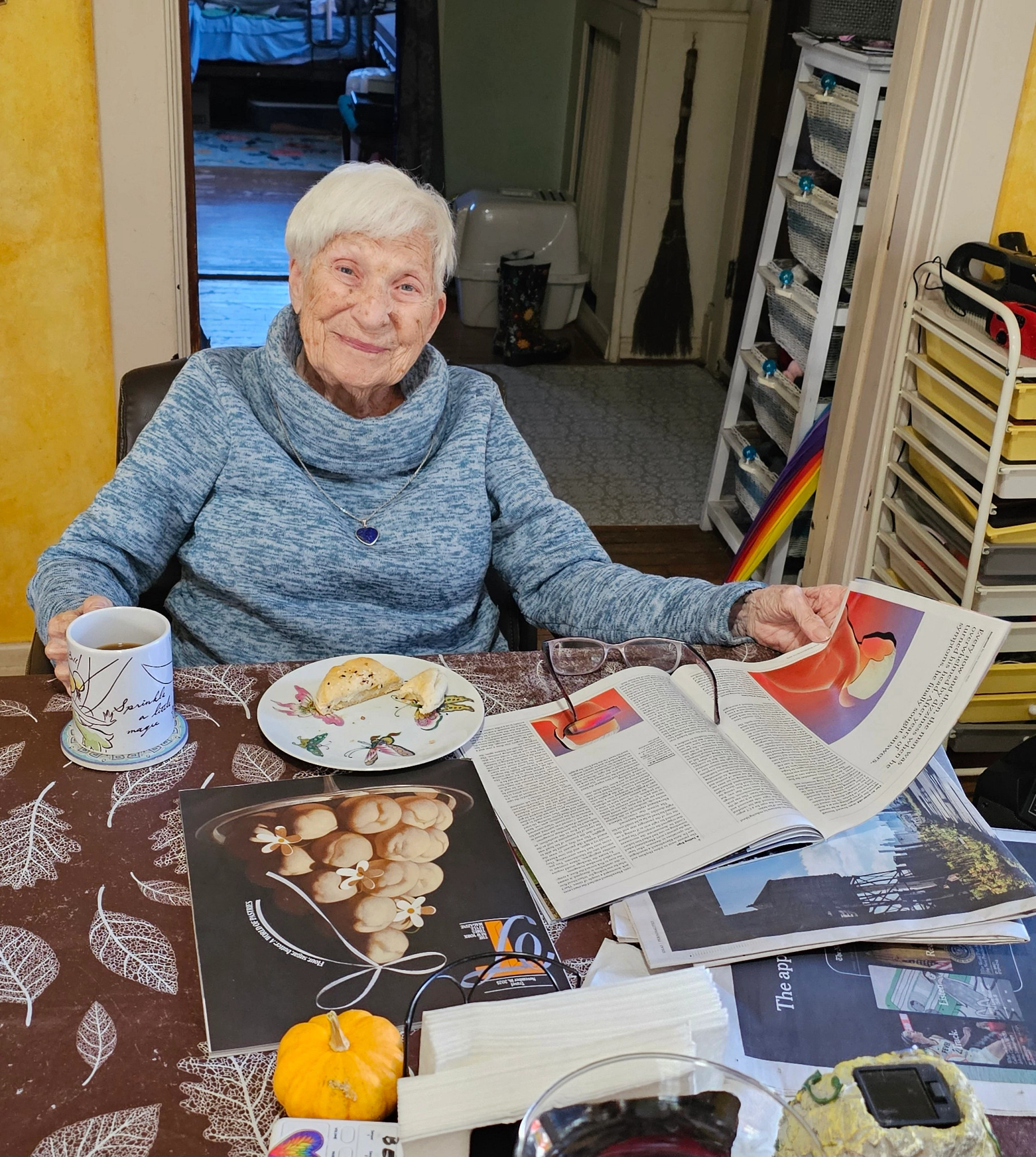 a photo shows Lisa Suhay’s mother reading the New York Times