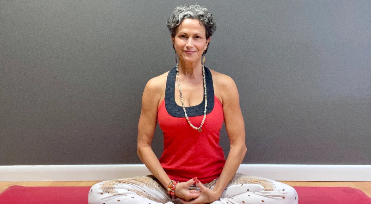  Julie Blamphin sitting on yoga mat