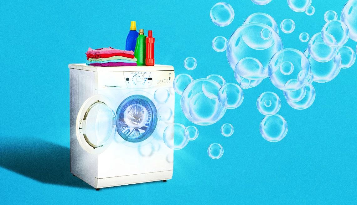 AARP Smart Guide to Laundry a washing machine with bubbles floating out of it