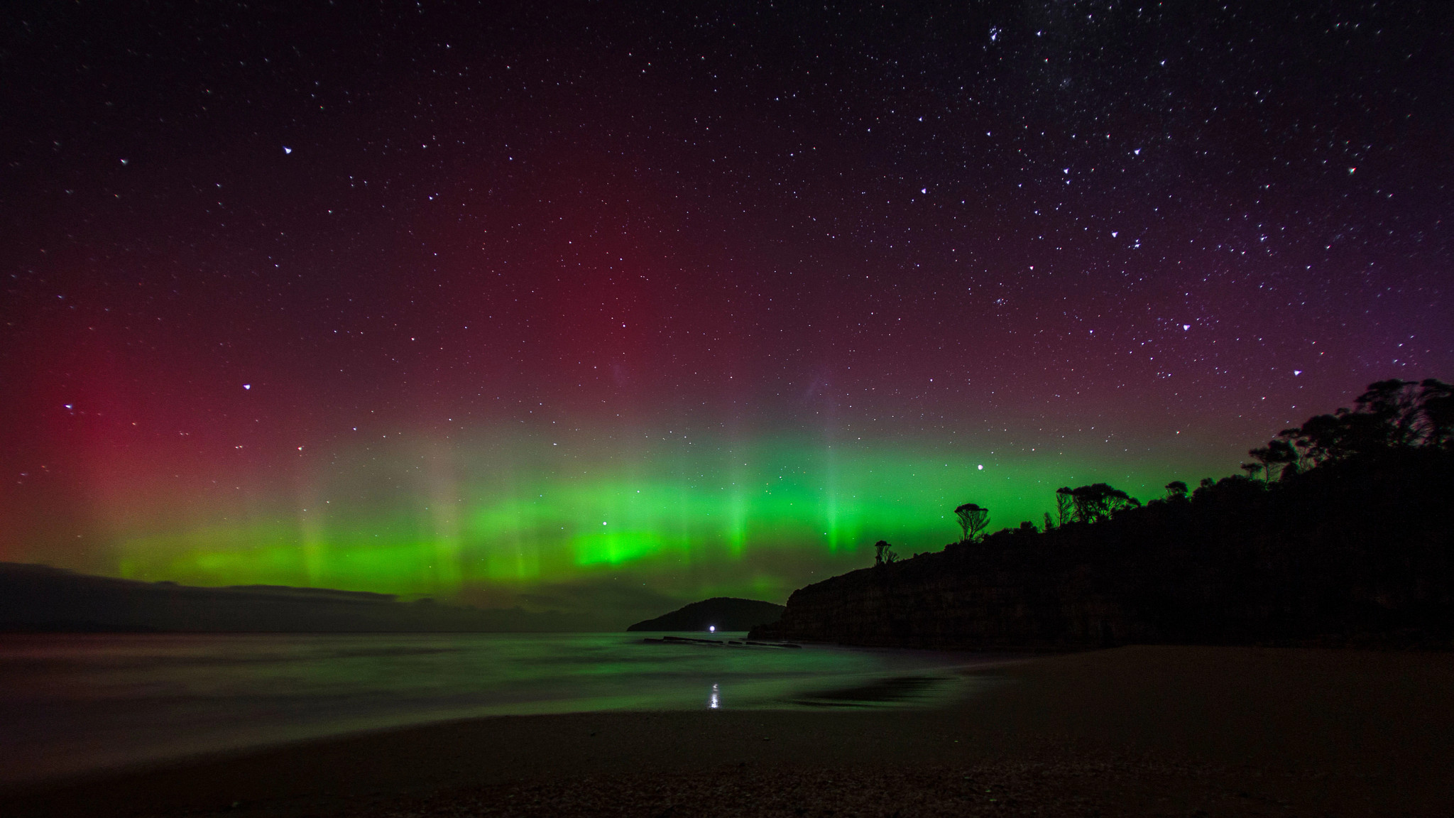 the southern lights illuminate water 