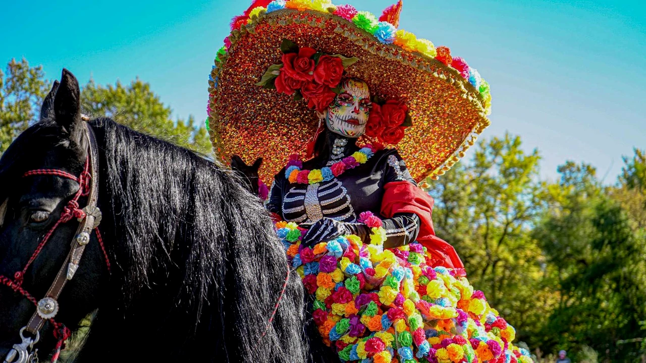 a woman in dia de los muertos makeup and dress