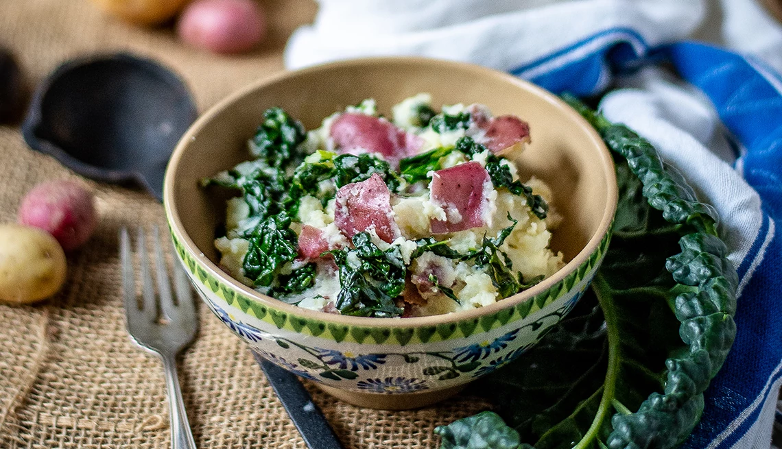 a bowl of calcannon with green cabbage