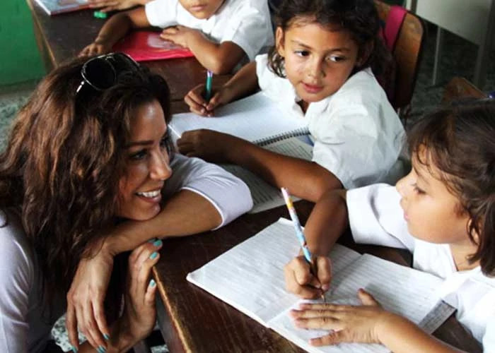 eva longoria interacting with children for the eva longoria foundation