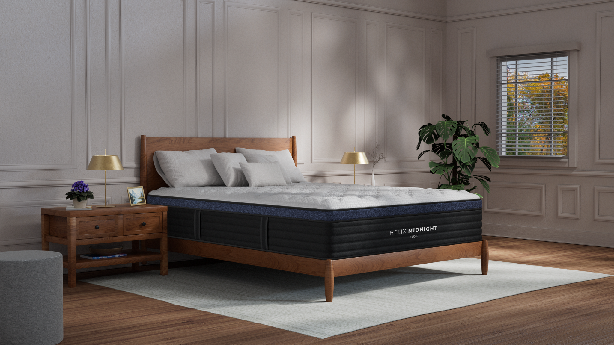 The Helix Midnight mattress in a white bedroom on a wood bedframe 