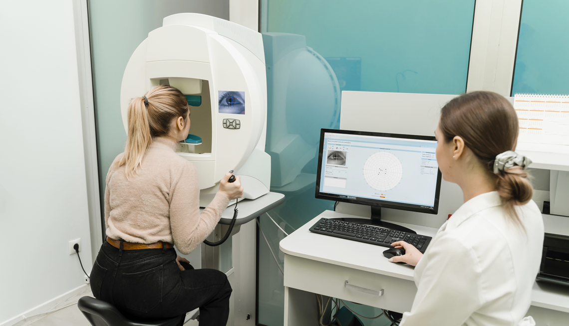 Regular eye exams can help detect peripheral vision loss. a woman getting an eye exam for peripheral vision loss