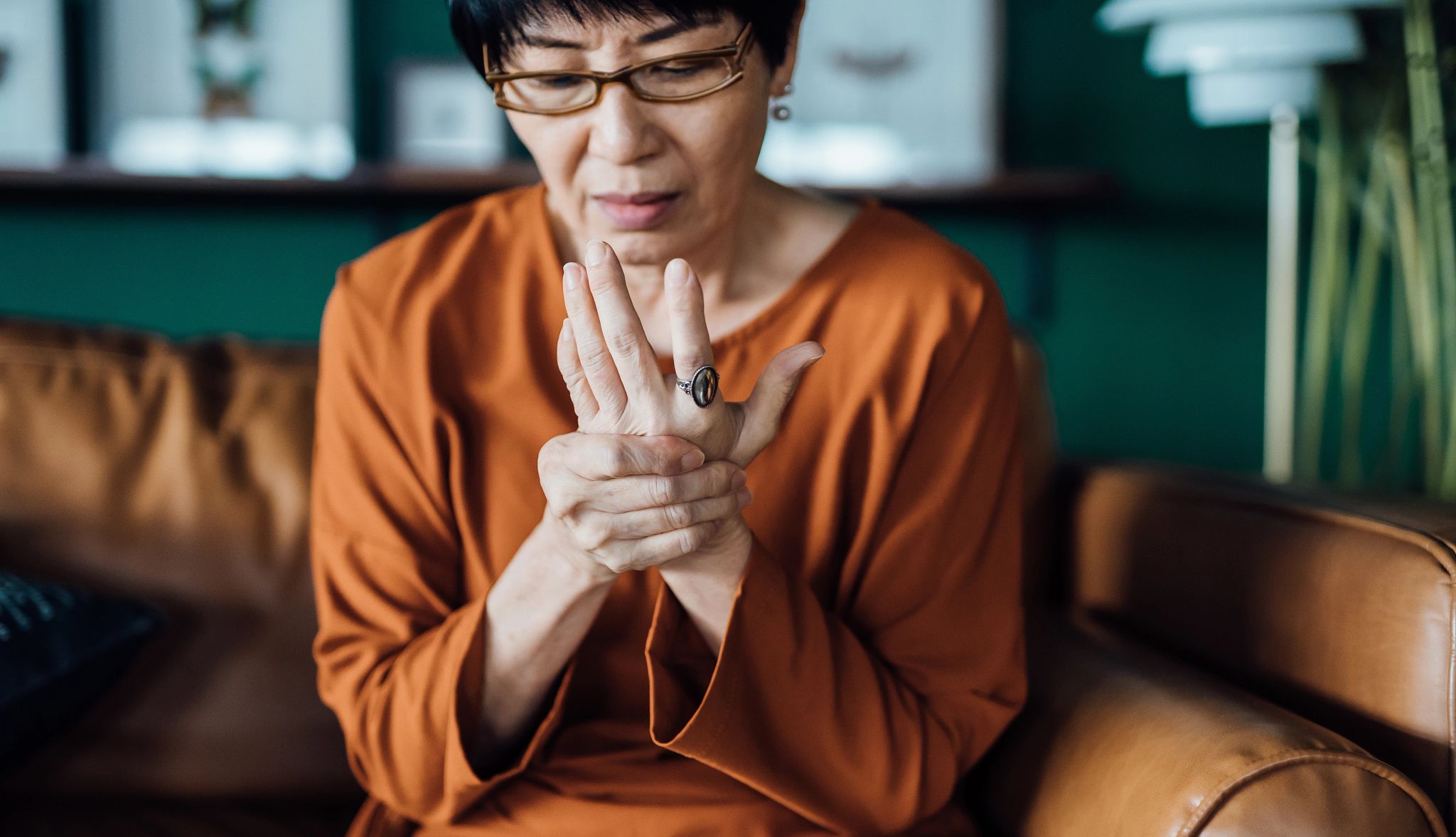 How to Reduce Inflammation woman rubbing inflamed wrist