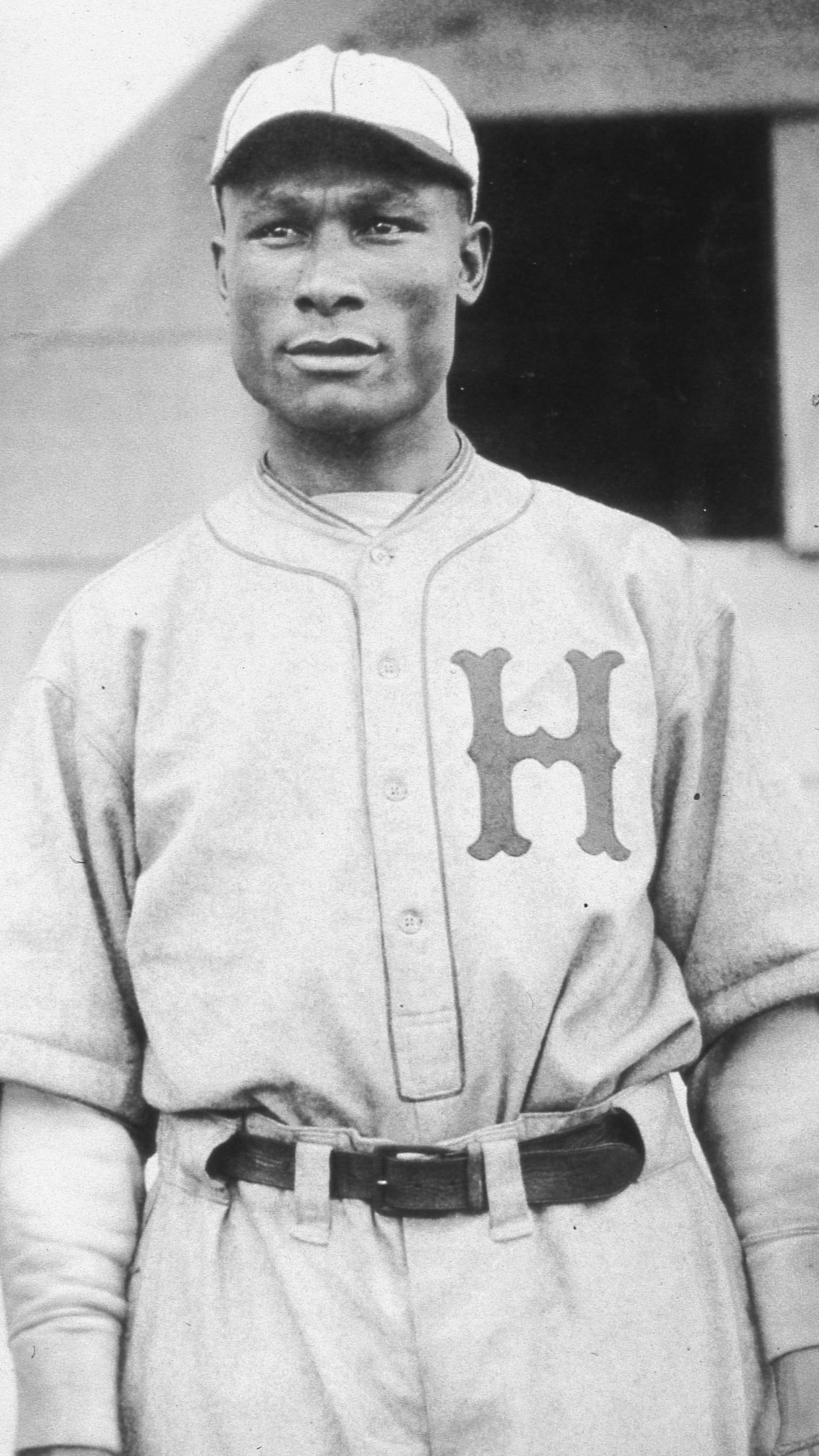 charlie “chino” smith in a baseball uniform.