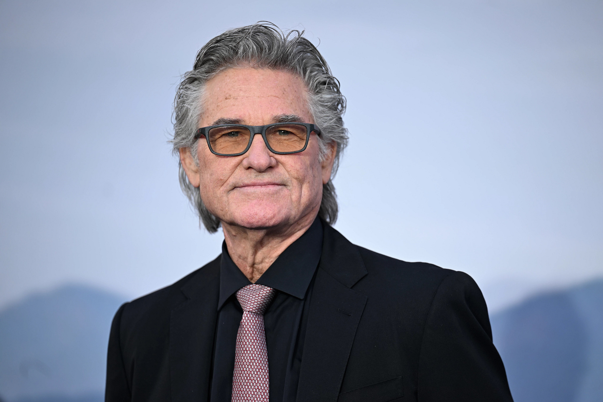 kurt russell posing for a portrait