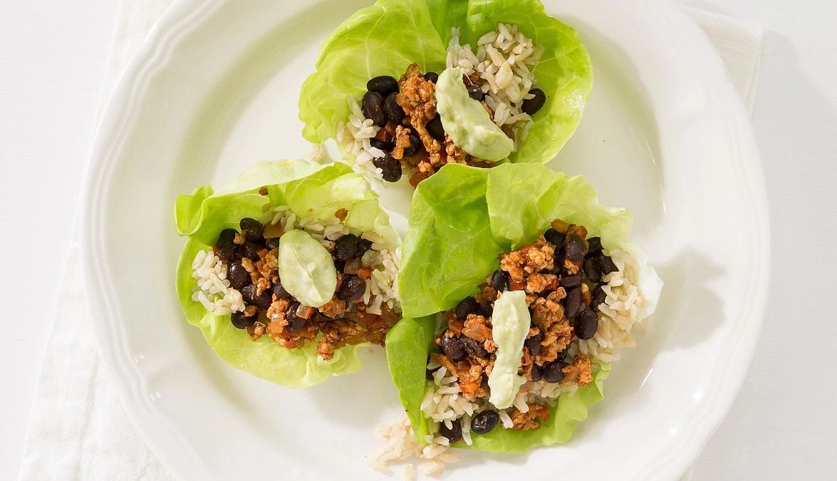 Turkey taco lettuce wrap A close-up view of three sisters succotash in a pan