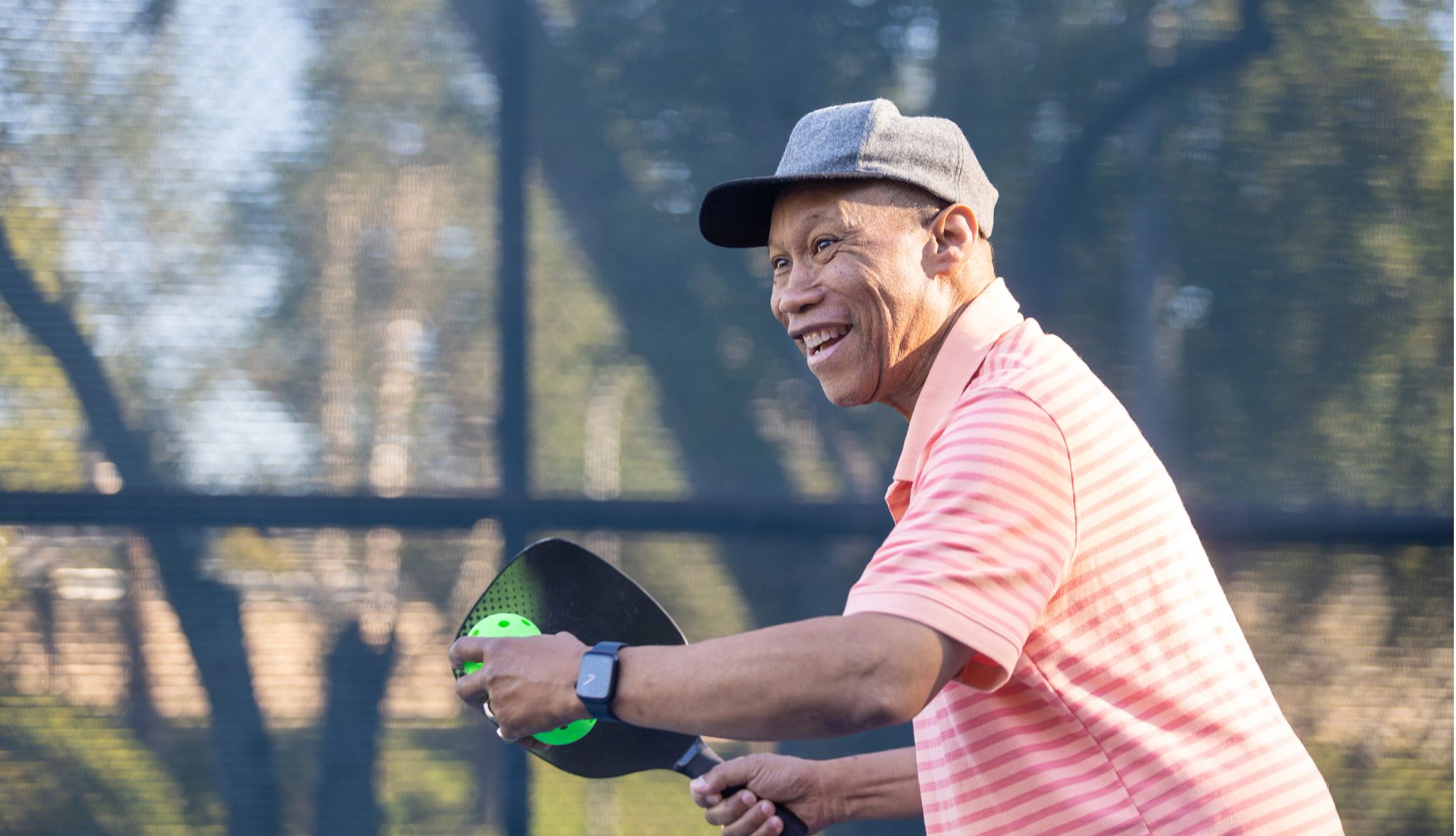 A senior black couple playing pickleball A senior black couple playing pickleball