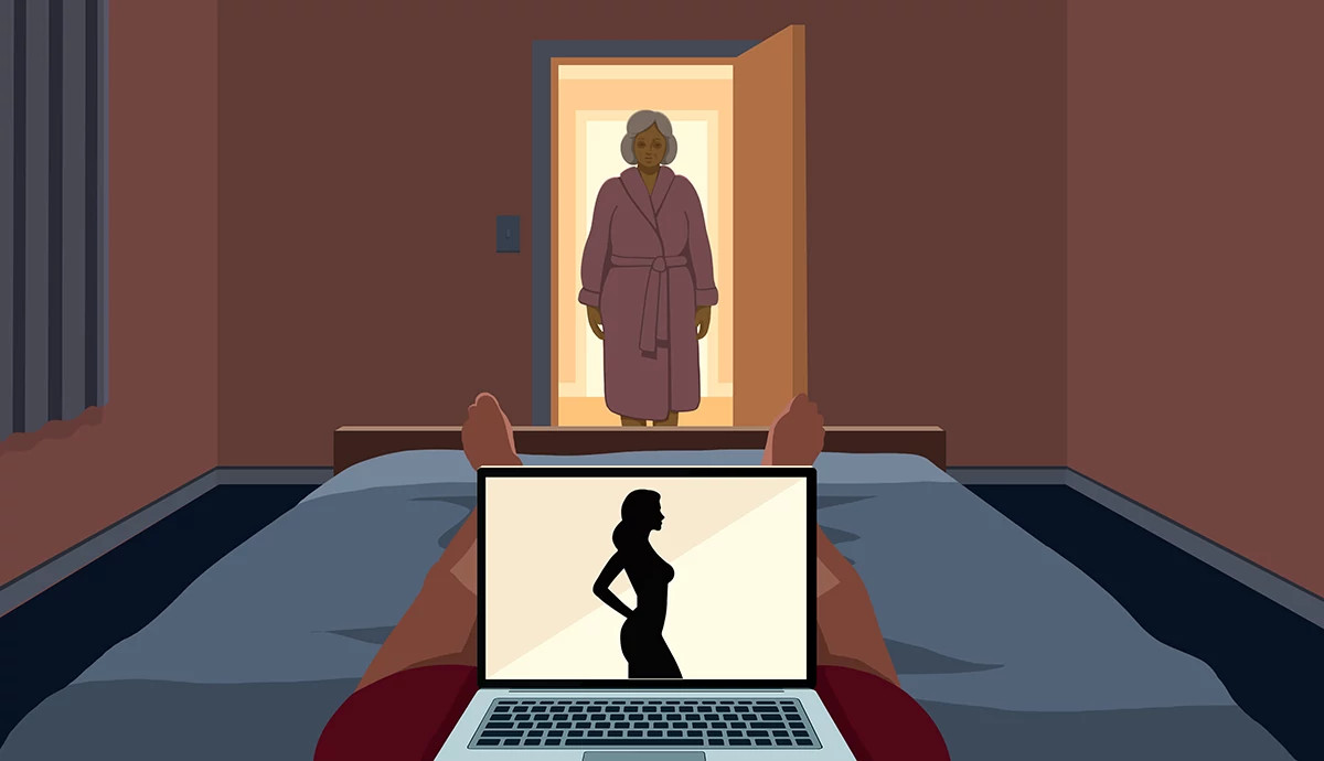An older woman walks into her bedroom where her husband is watching porn on his laptop in bed