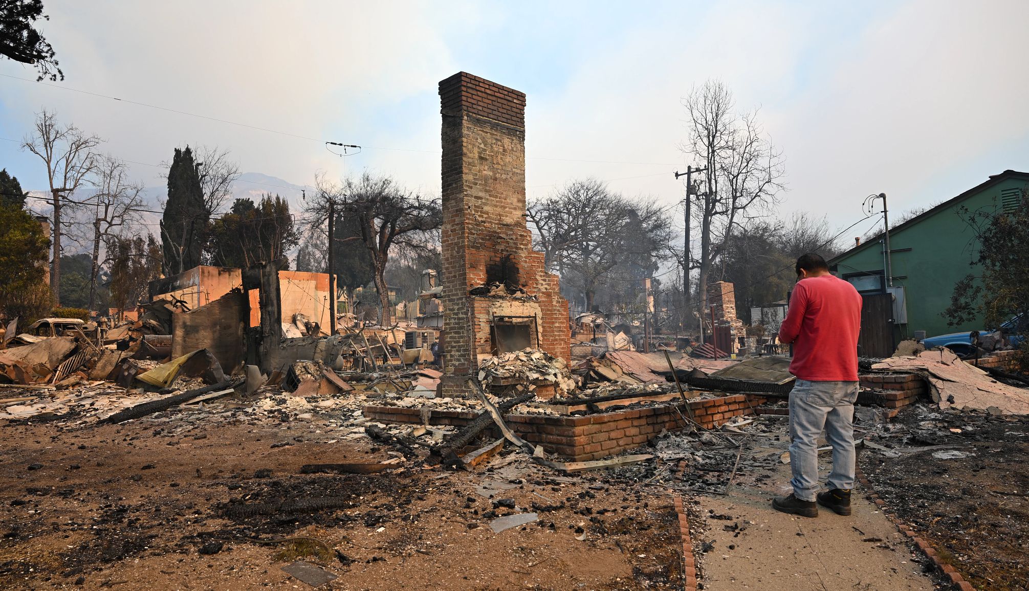 Relief Fund for Los Angeles Fire Victims residents inspect rubble of their burnt homes