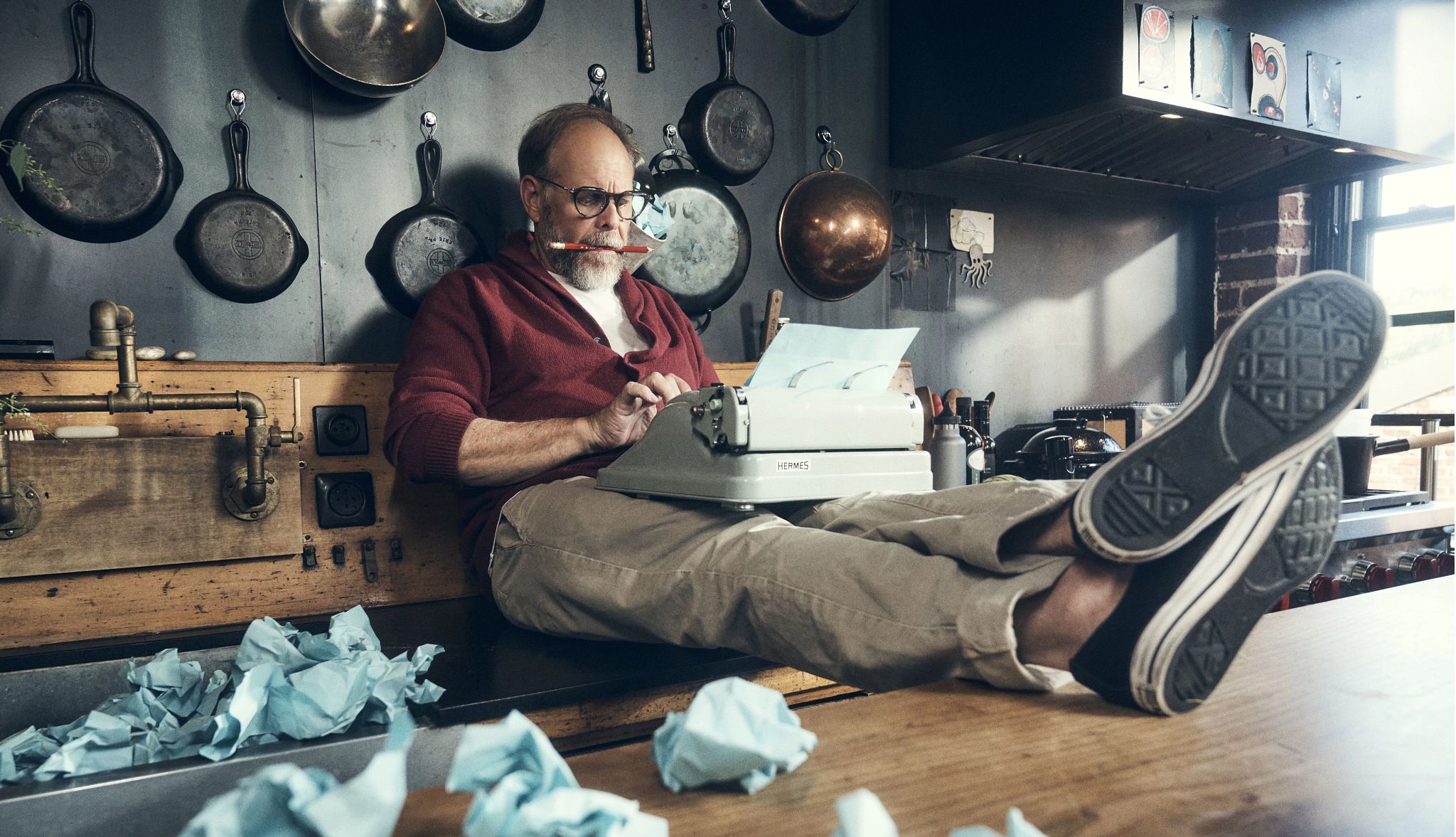 Alton Brown alton brown working on a typewriter