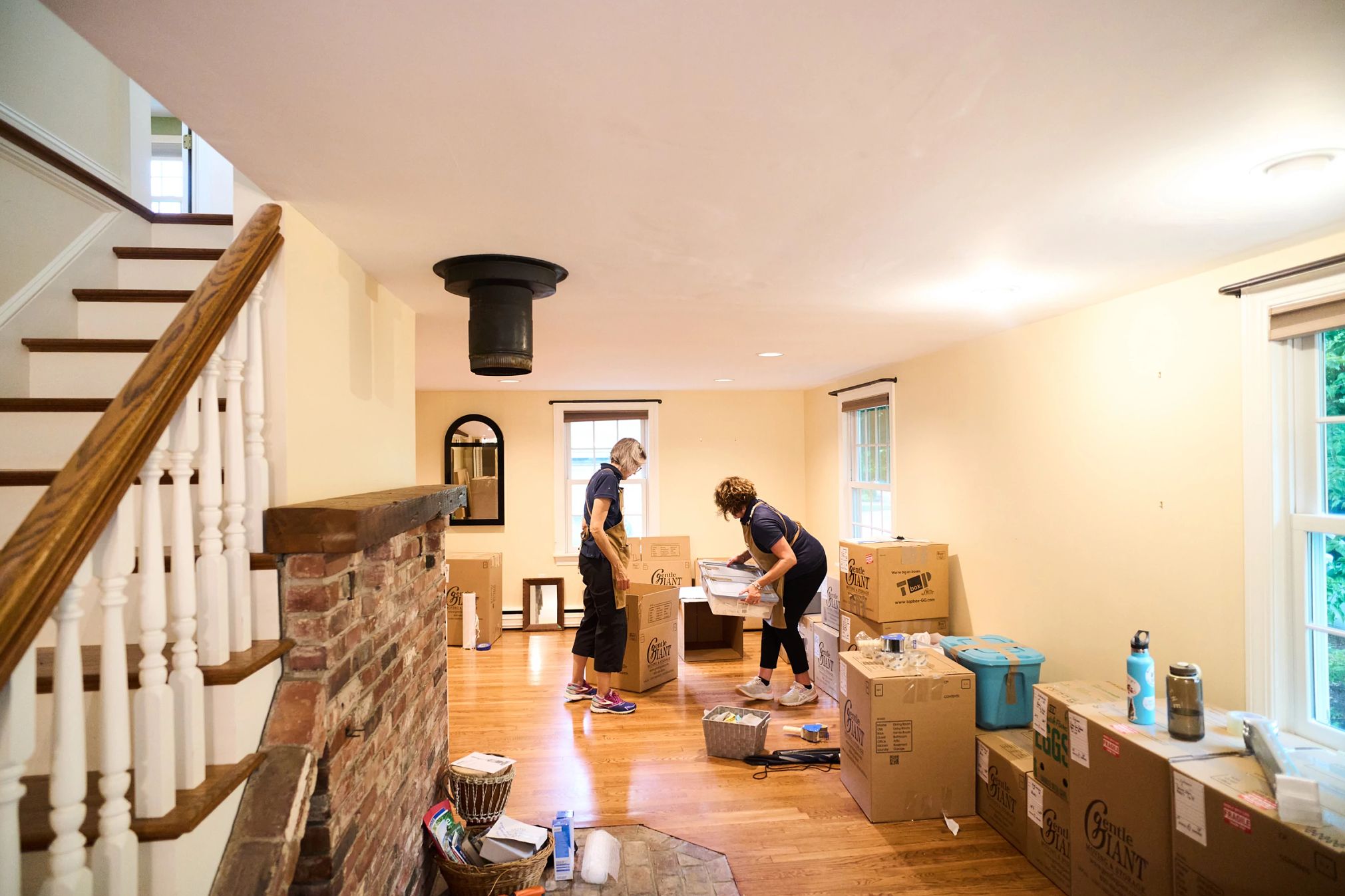 Can This Couple Find Familial Bliss Across the Country? people packing up their belongings in their old house