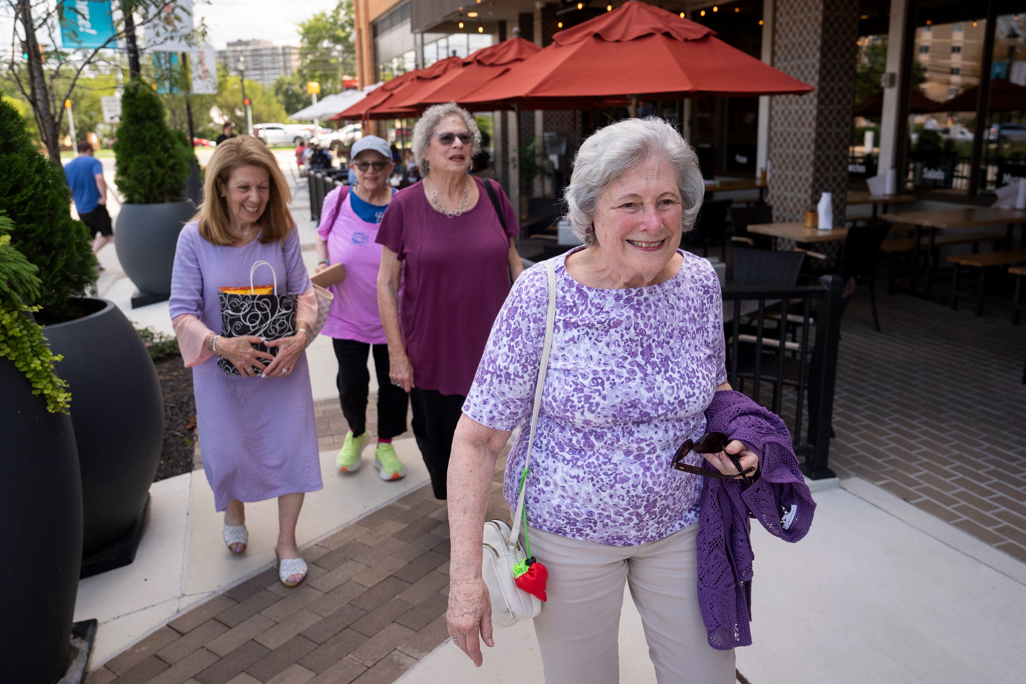 Mary Hammer walking with her friends after having lunch