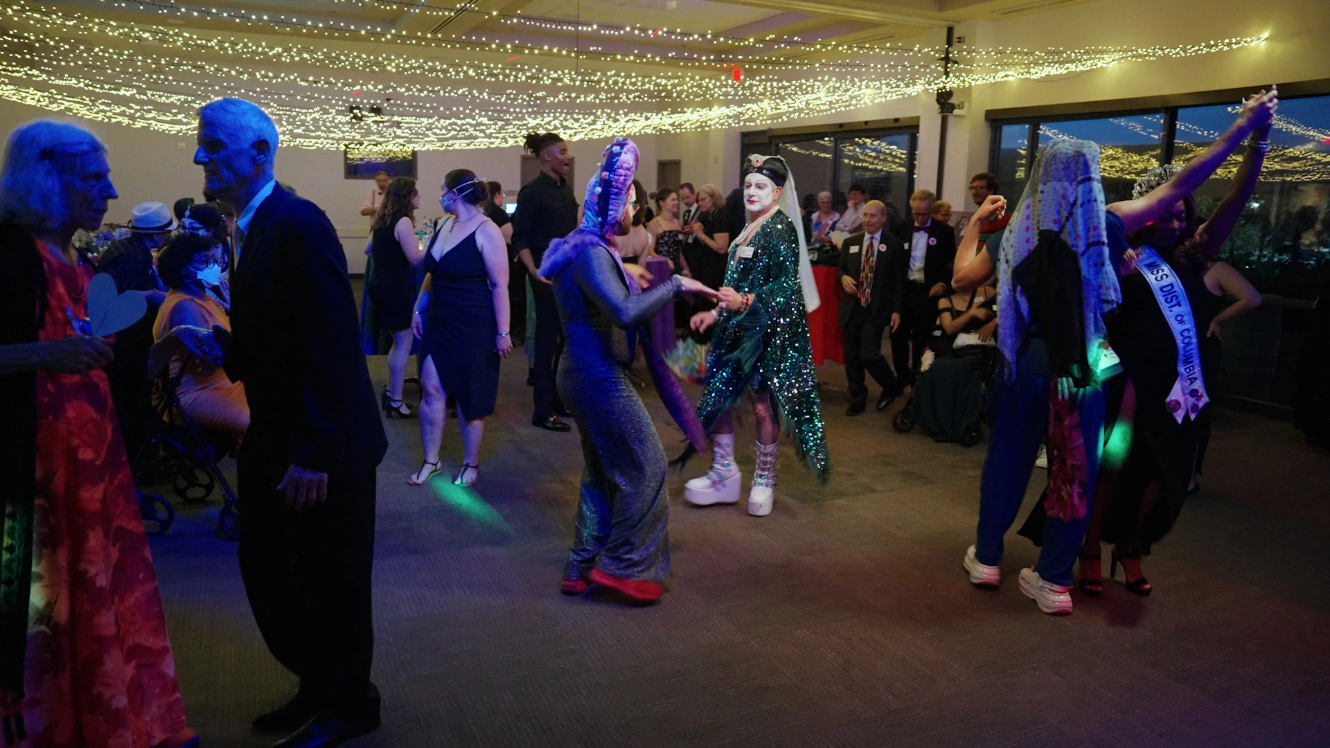 a photo shows attendees making their way to the dance floor during Pride Senior Prom