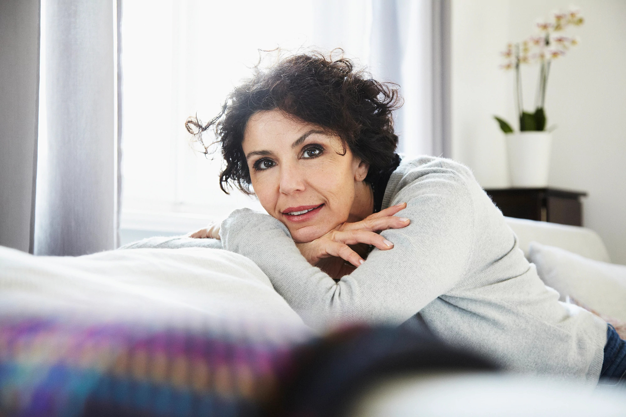 Portrait of relaxed woman in living room
