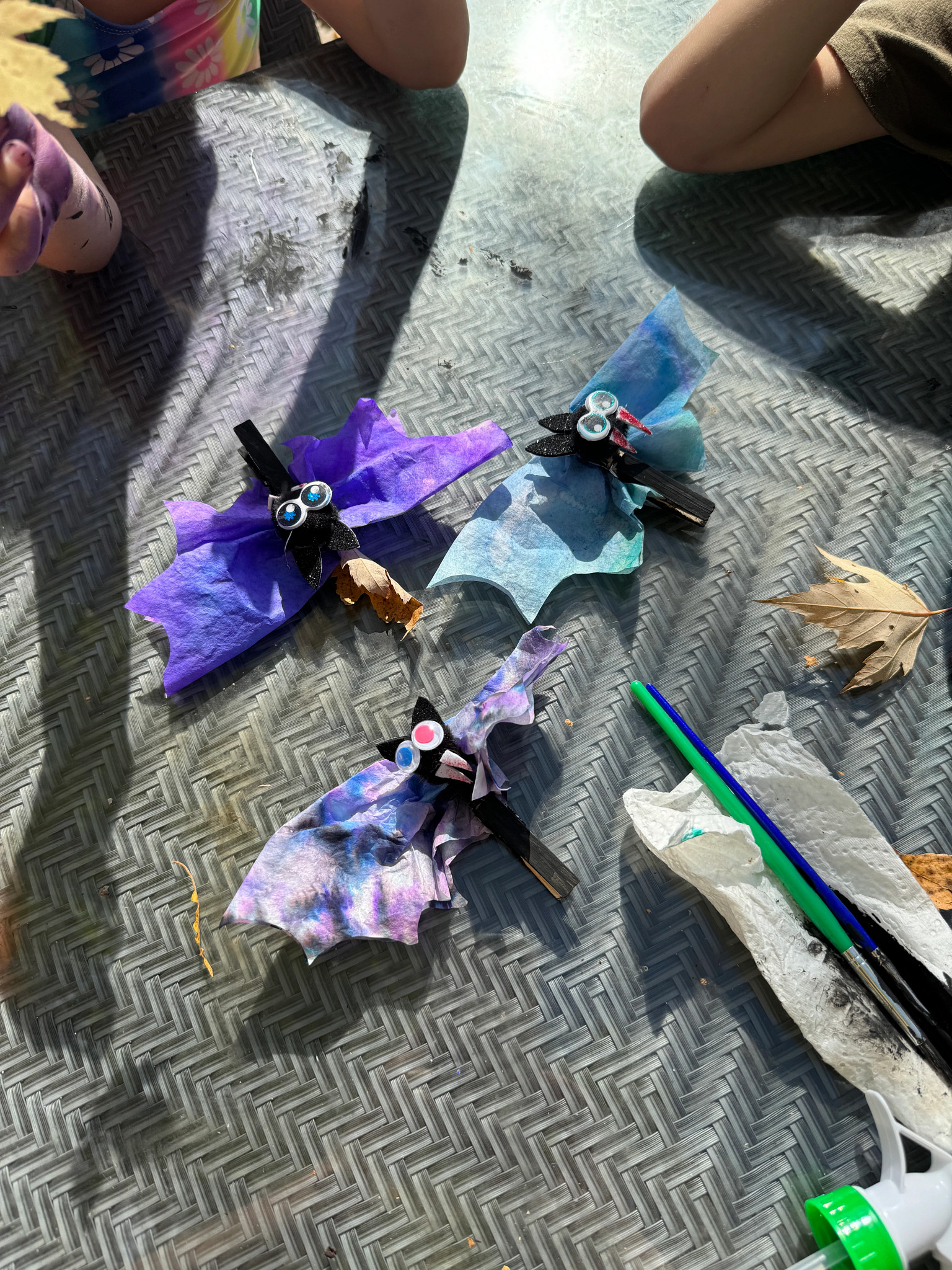 A collection of colorful bats made from coffee filters
