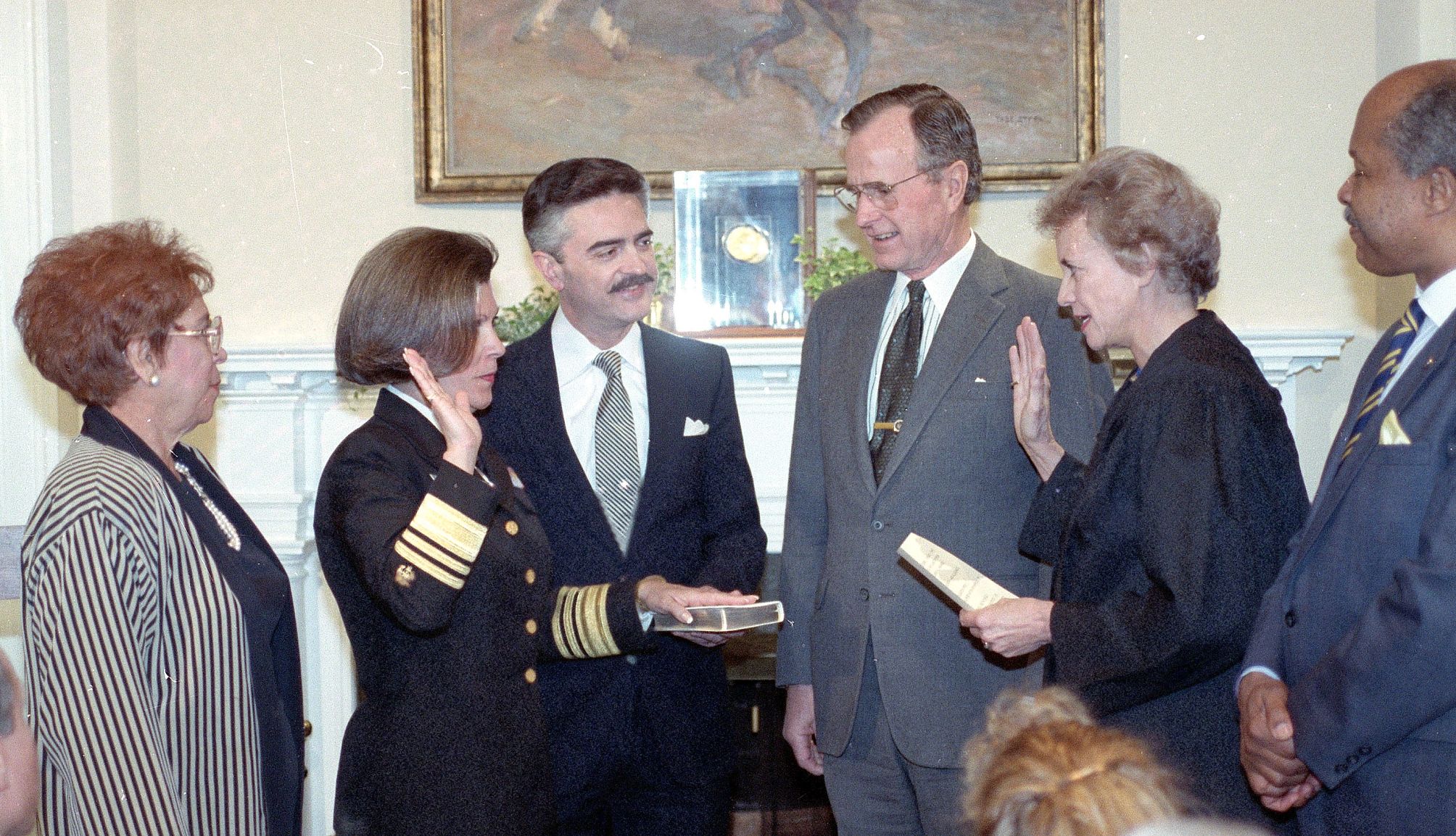 Antonia Novello, M.D. being sworn in while her mother and husband observes Antonia Novello, M.D. is being sworn in