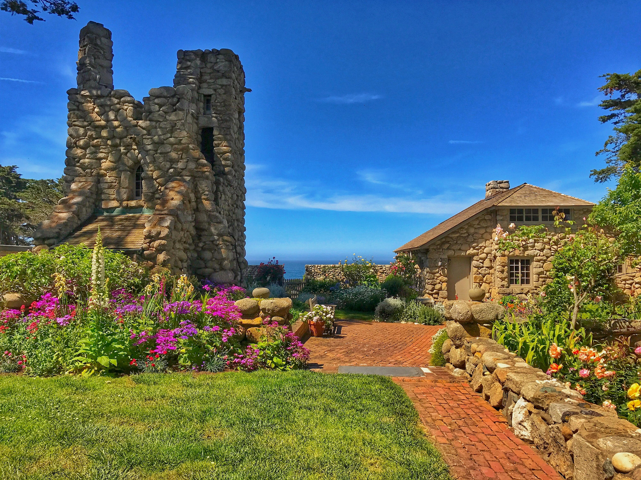 a cottage and Hawk Tower