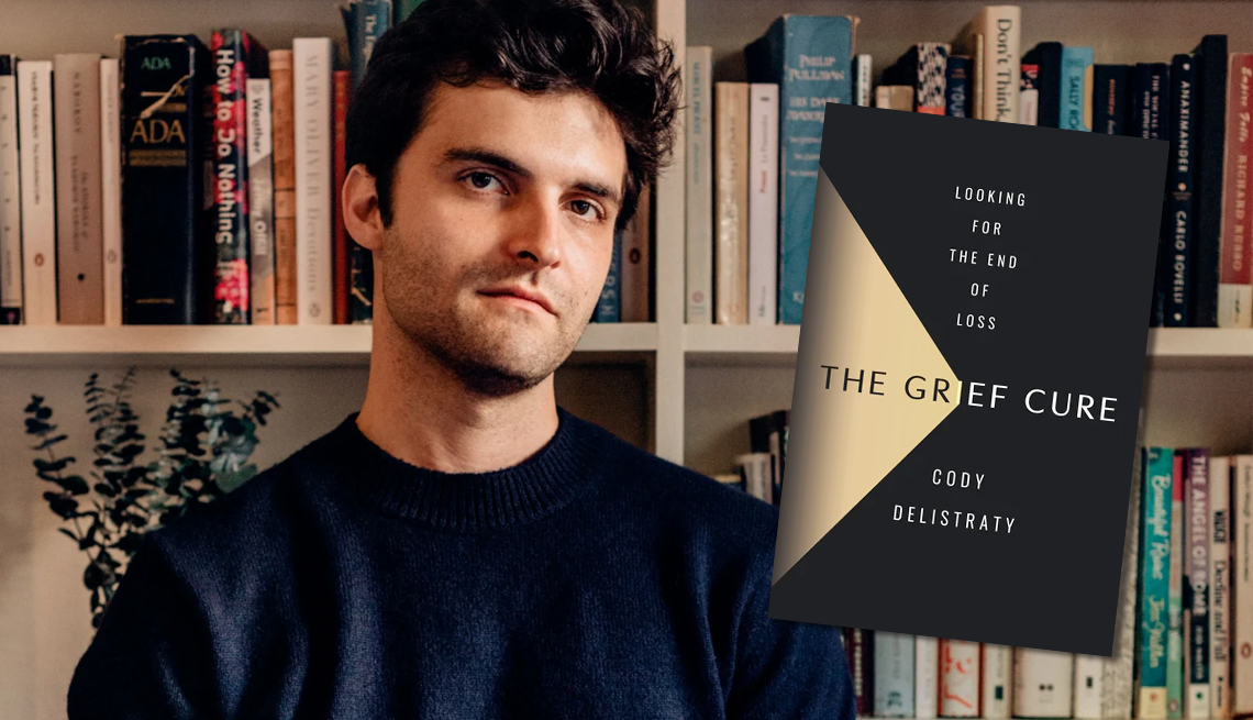 'The Grief Cure' author Cody Delistraty Cody Delistraty stands in front of a bookcase next to the cover of his book: the grief cure looking for the end of loss.