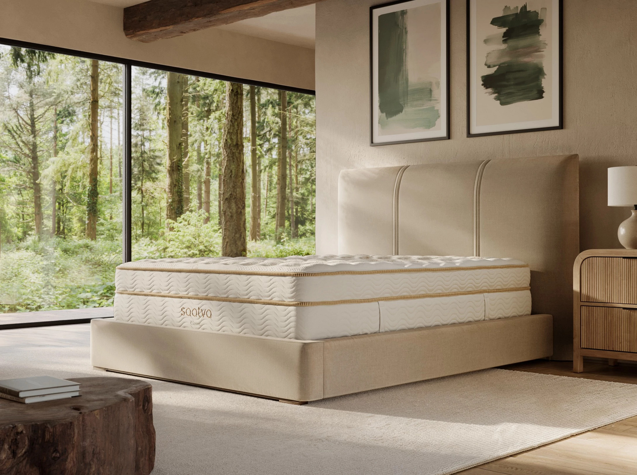 The Saatva Classic mattress in a bedroom with a large window.