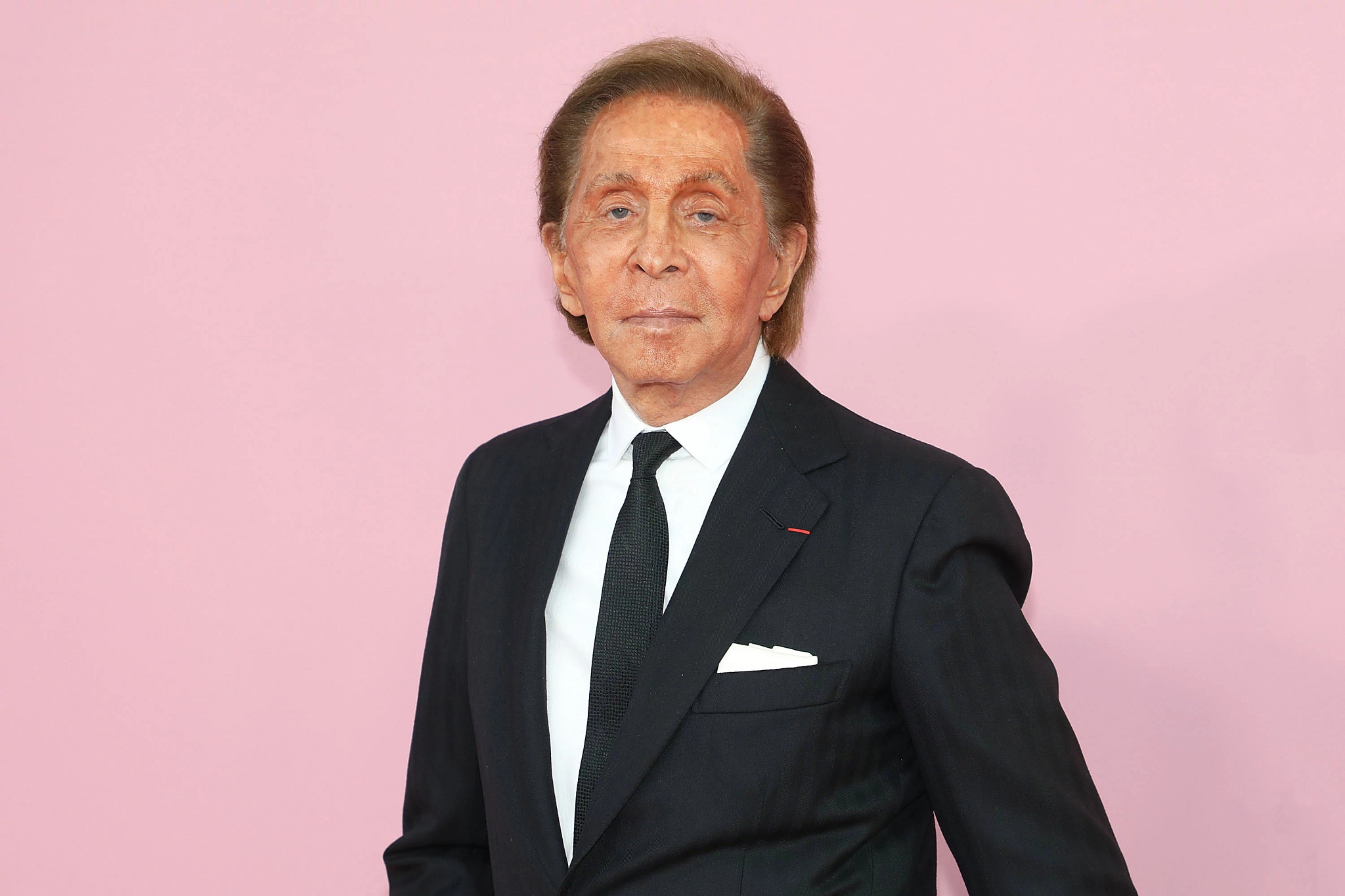 designer valentino against a pink background