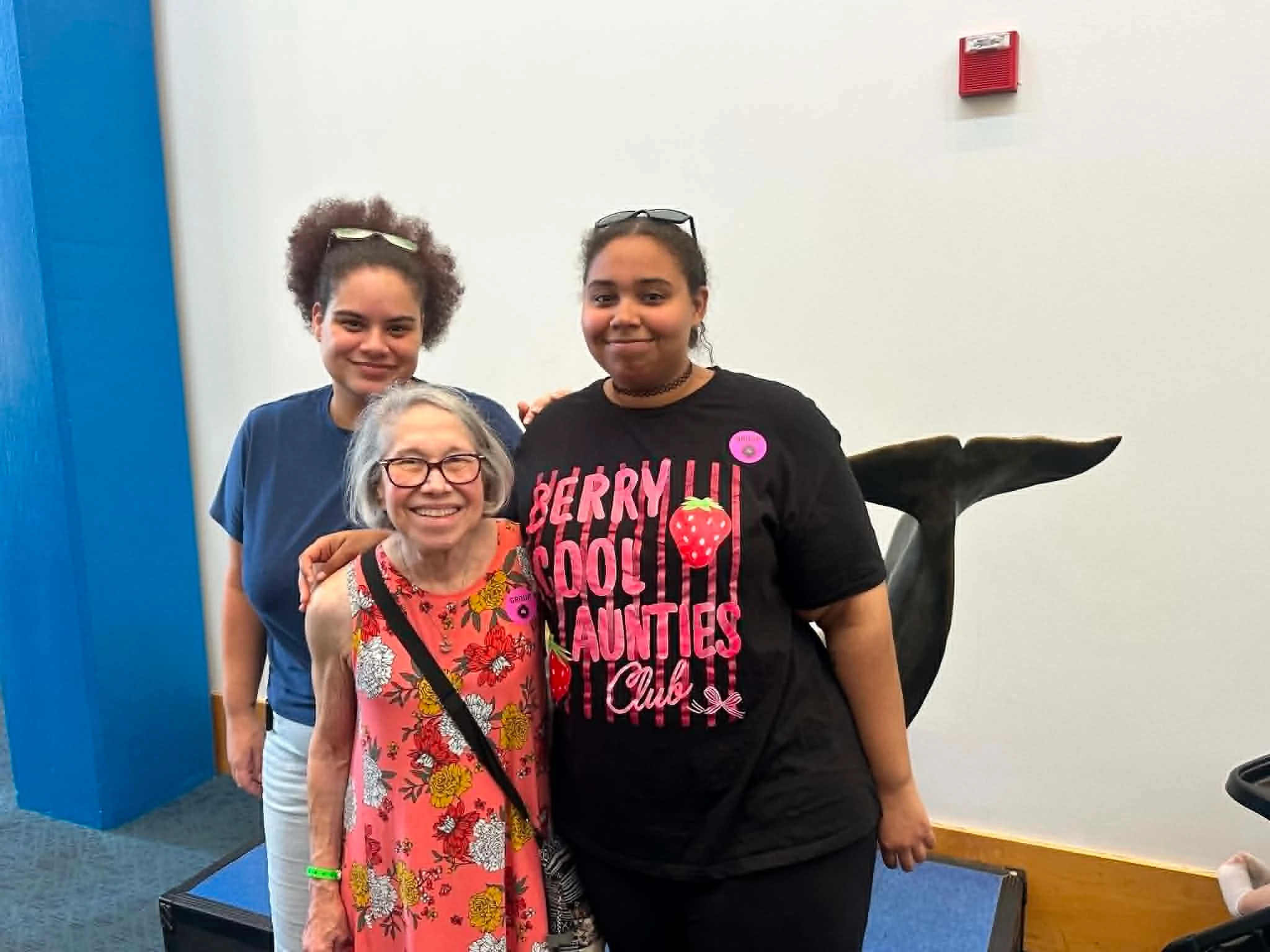 multi-generational group photo at the aquarium