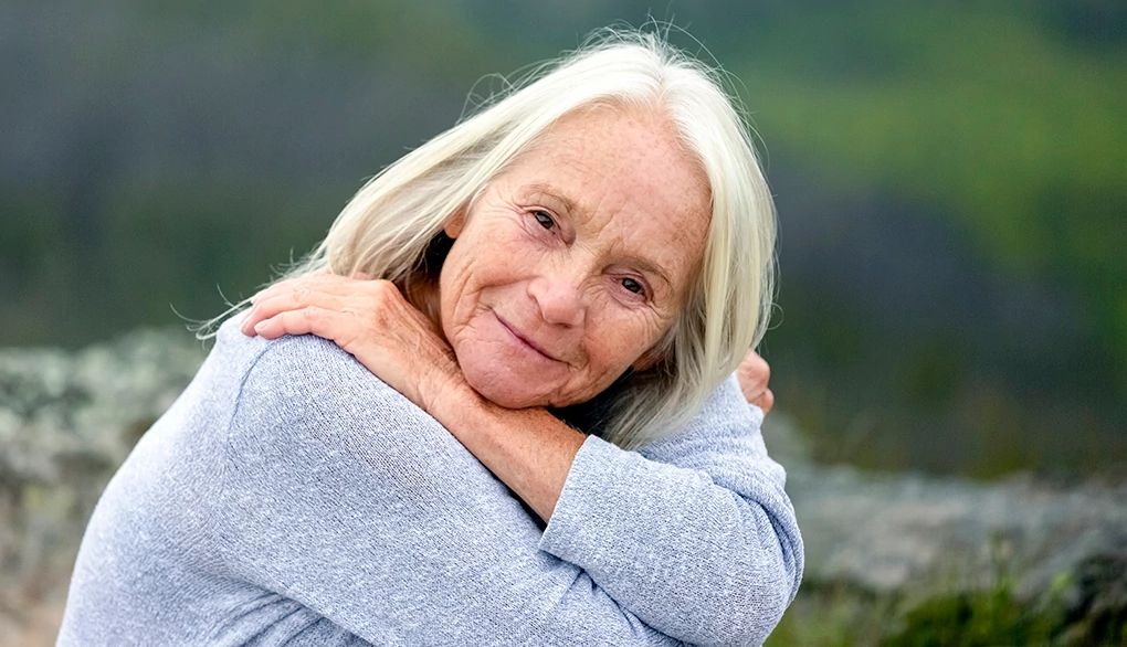 People often find some difficulty in believing they deserve to be happy A portrait shot of a woman smiling outside