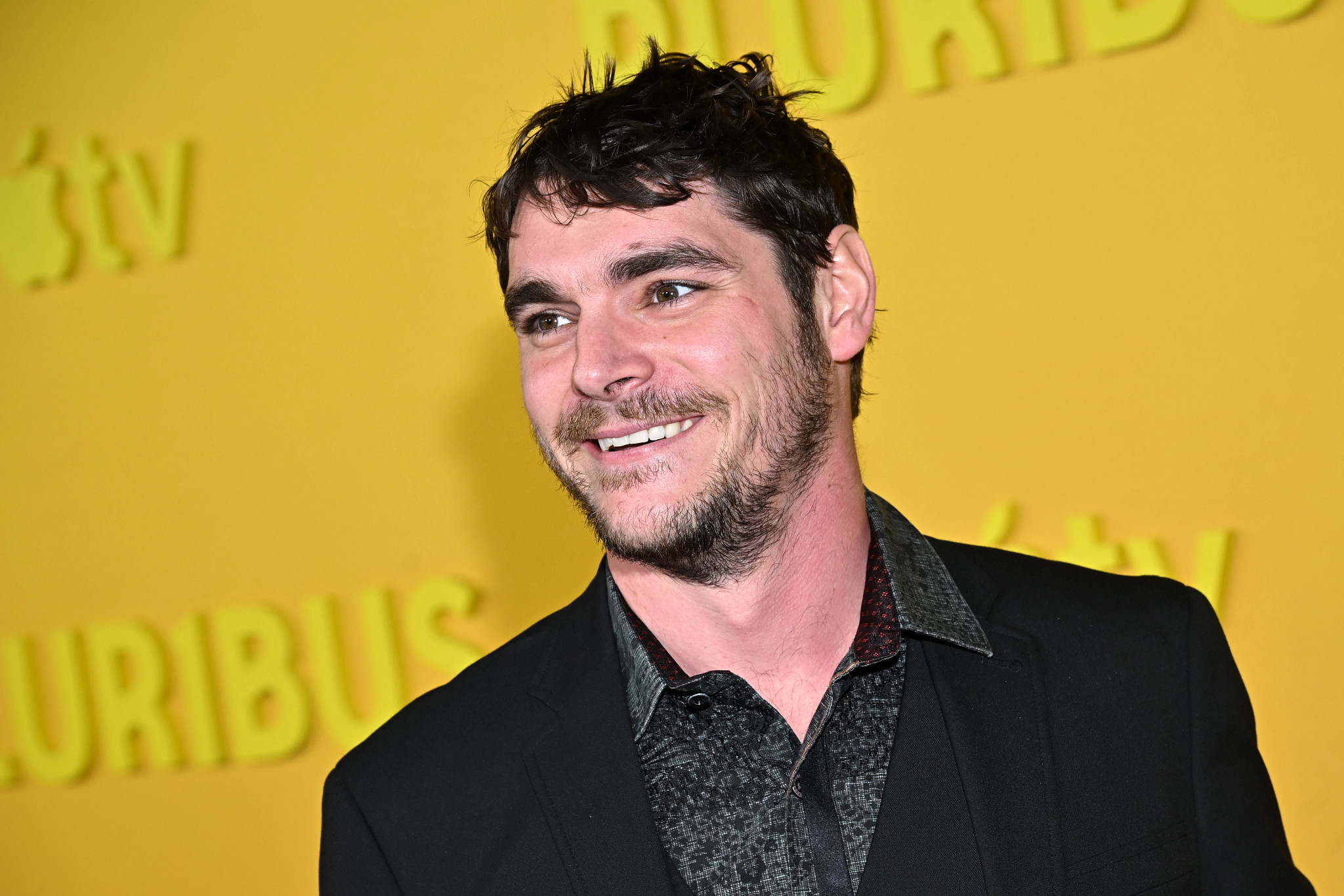 rj mitte smiling on a red carpet