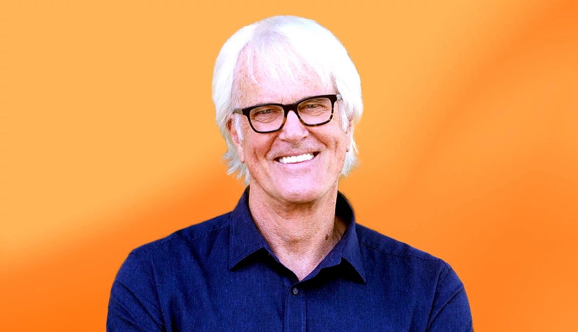 John Tesh interview John Tesh against orange ombre background
