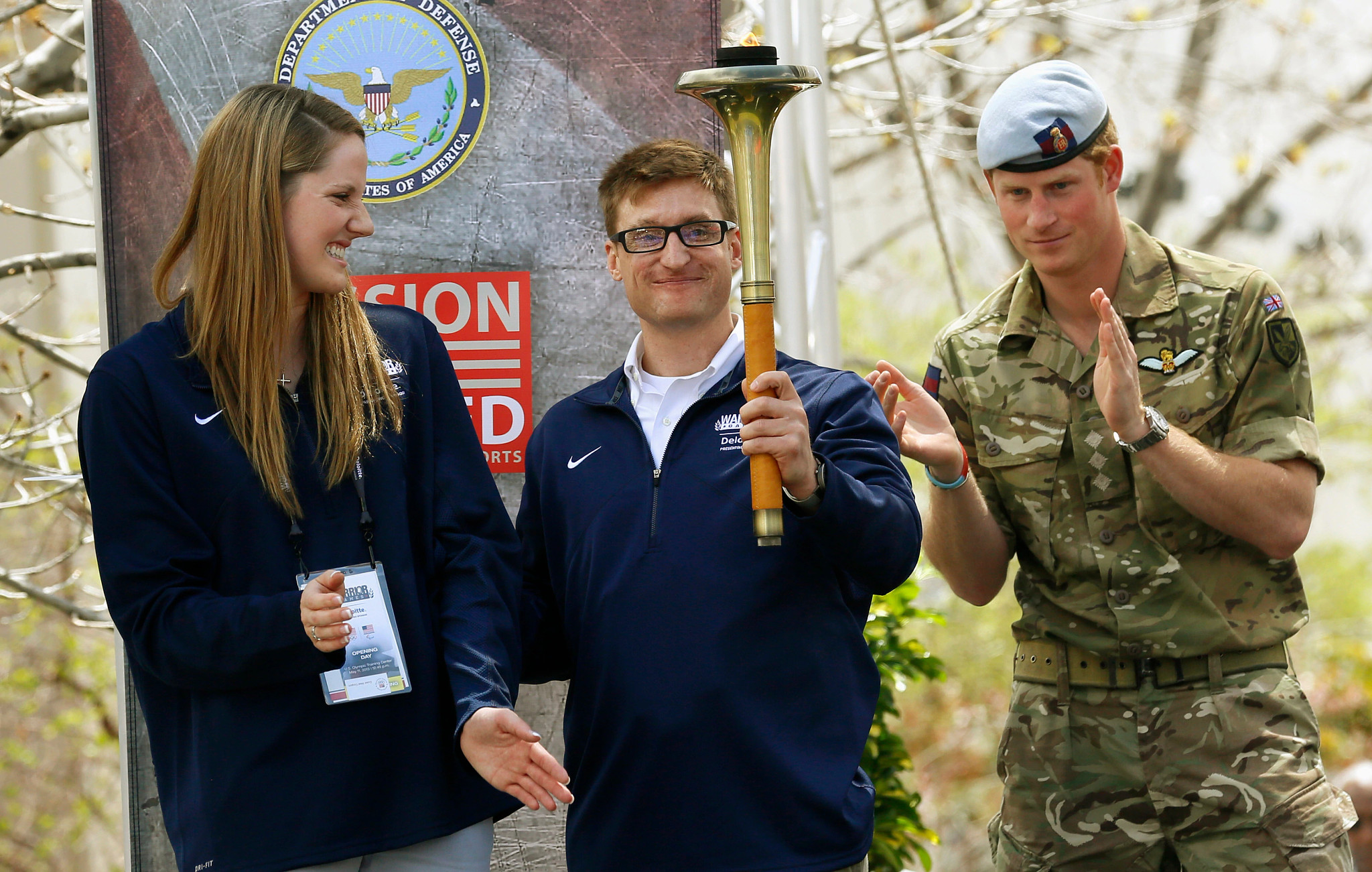 brad snyder holds the olympic torch