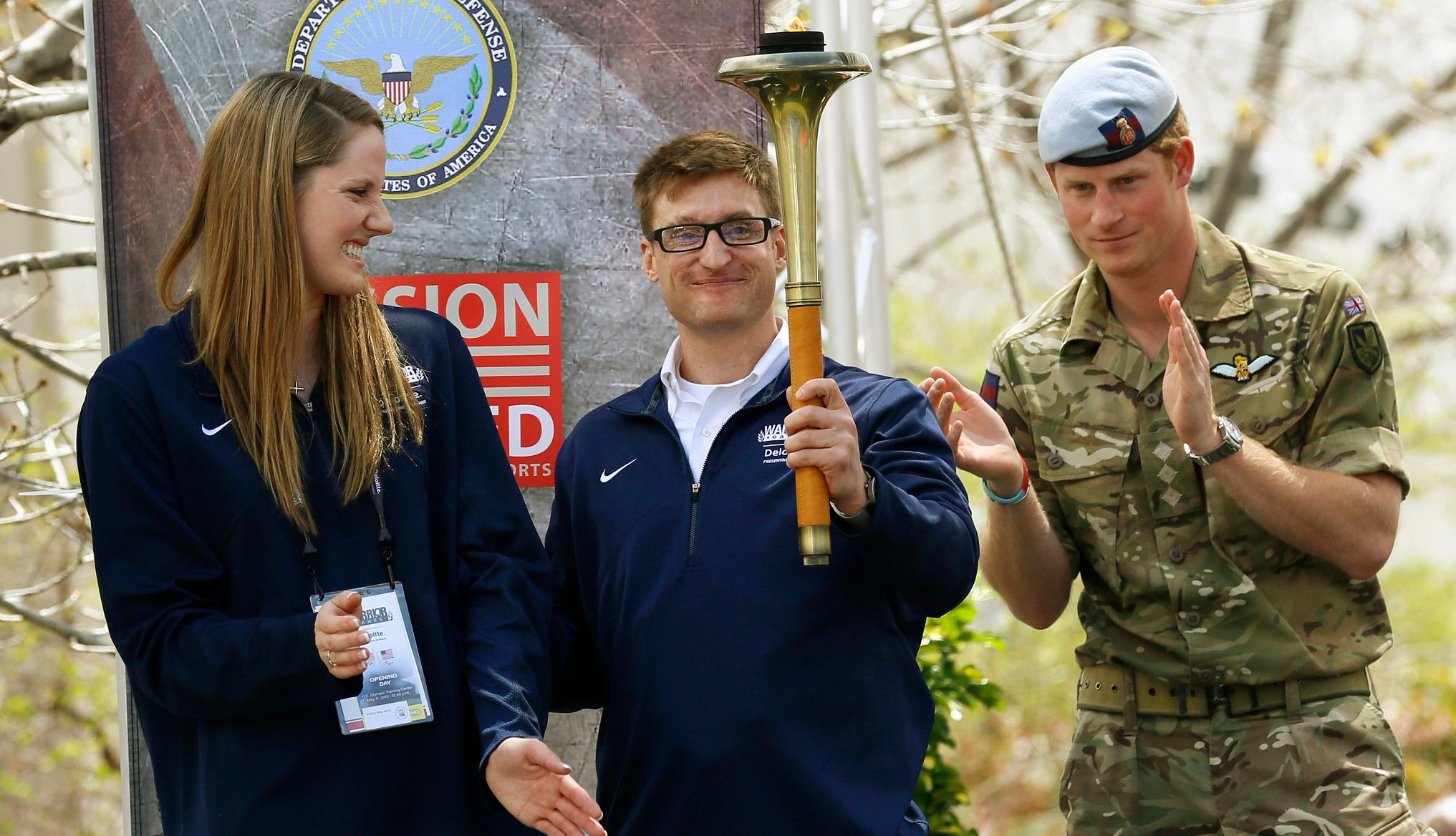 Missy Franklin, Brad Snyder and Prince Harry brad snyder holds the olympic torch