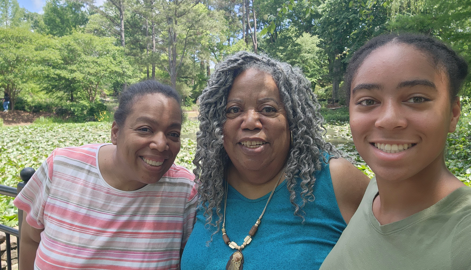 Introvert Extrovert Travel three women smiling into the camera while outside