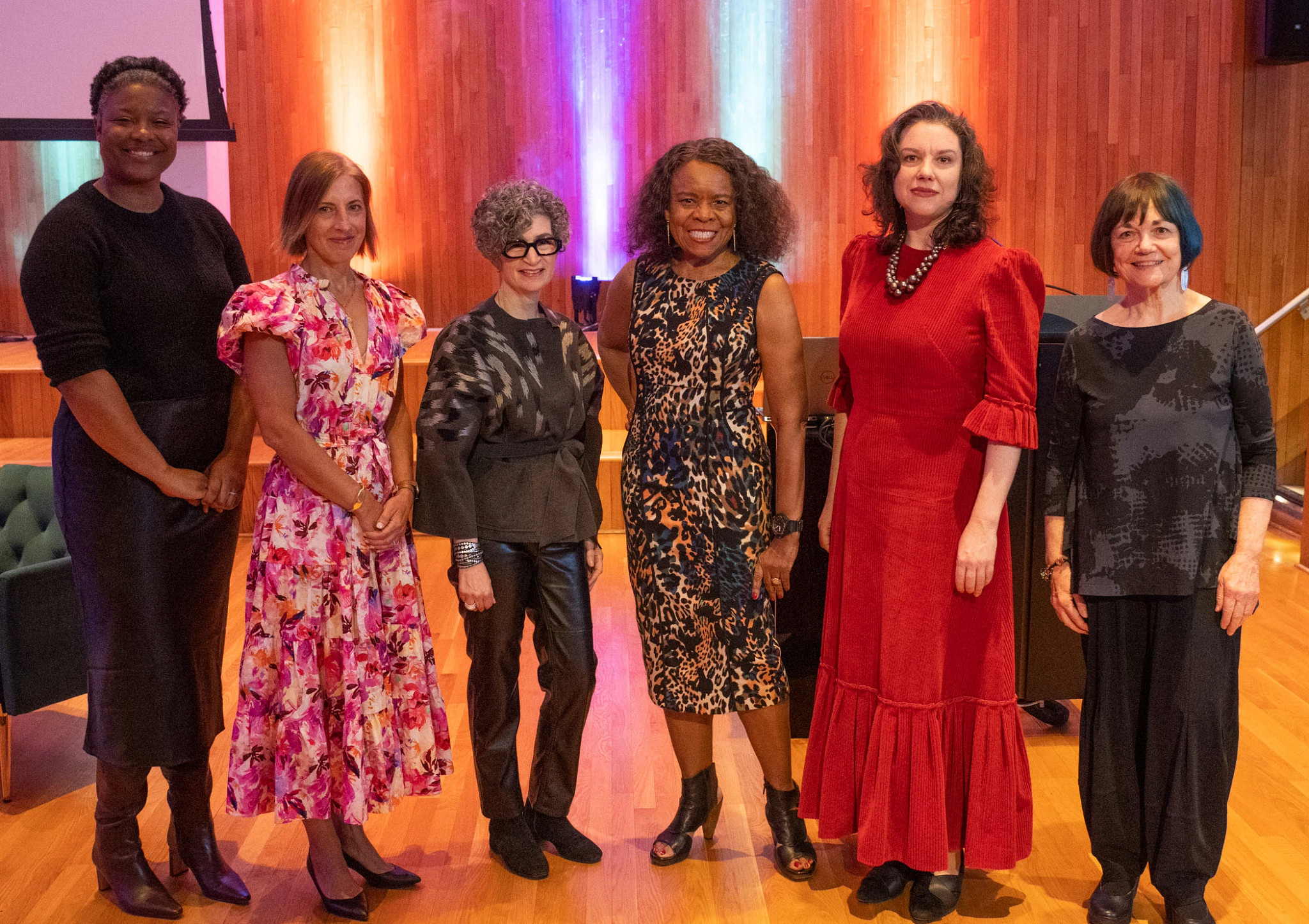 women standing together at a fashion event