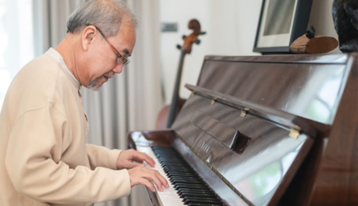 Music may be able to help those with dementia or cognitive decline A man playing a piano with another string instrument in the background