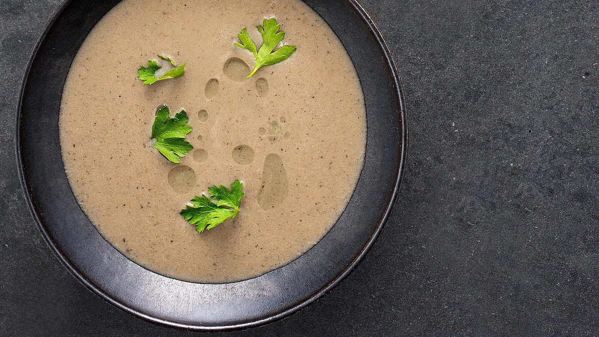 A close-up view of double celery soup in a bowl
