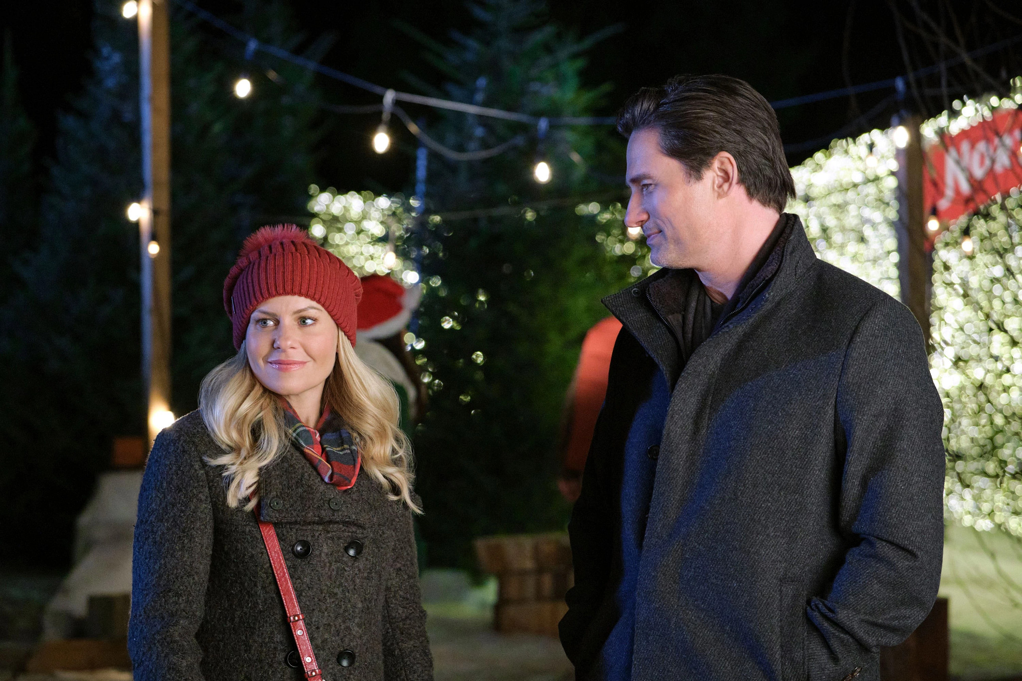 candace cameron bure and warren christie in a scene from if only i had christmas